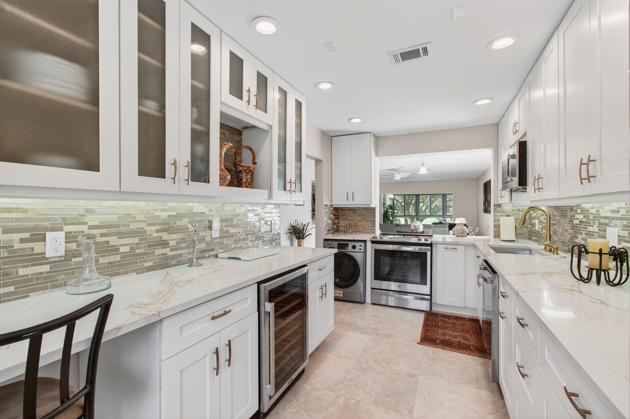 GOLFER'S PARADISE....COUNTRY CLUB living at its finest !!! STUNNING Remodeled 2/2 Light & Bright 2nd floor Crnr Condo in Hunters Run - Prestigious Golfing Community with Amazing Facilities in Boynton Beach, FL.  1,600+'. ft Tastefully Decorated, One-of-a-Kind Totally Remodeled Kitchen with all new SS appliances, including Wine Frig, Counter Height W/D. Quartz Countertops, 42" Glass Face Cabinets, Undercounter Lights, Pantry, Breakfast Bar, Pullout Soft Close Drawers.  Large En-Suite Master w huge walkin & 3 addtl closets. Remodeled Master Bathroom, w Dual Vanities, Linen Closet.   All-season Florida room with Hurricane Impact Windows overlooking spectacular golf vistas.   100% Carpet Free, Popcorn Free.  Remote Controlled Ceiling Cans & Lights. Maint incl Cable w 3 Boxes, Internet.   Too Many Features - Must be Seen., Lush Landscaping on Beautifully Appointed Grounds . 24-hr Manned Security, Gated Community Boasts 3 Spectacular Newly Sodded Golf Courses, Newly Renovated State-of-the-Art Clubhouse with 7 Restaurants, Incomparable Pool System, Har-Tru Tennis Crts w Lights, Pickle, Gym, Ballroom, Media, Card, Exercise & Weight Rms, Library, Shows, Mah-Jong, Bridge, Canasta, Clubs, Men's & Ladies' Card Rooms, Activities++++. Easy Access to Malls, Entertainment, Museums, Shopping, Dining, Beaches, Intracoastal, Everglades, Highways, Parks. Polo, Houses of Worship & Everything Florida Lifestyle Has to Offer.  Pet-friendly, Convenient to Shopping, Highways, PBI, Everglades, Theatres, Entertainment, etc. Also available for Seasonal, 6-Month or Annual Lease. Some furniture negotiable. ECM Home Warranty in place. Non-Refundable Equity membership of $150,000 payable by buyer at closing. Social annual membership mandatory, additional golf & racquet fees - see Fee Schedule online (Seller is Licensed RE Broker).