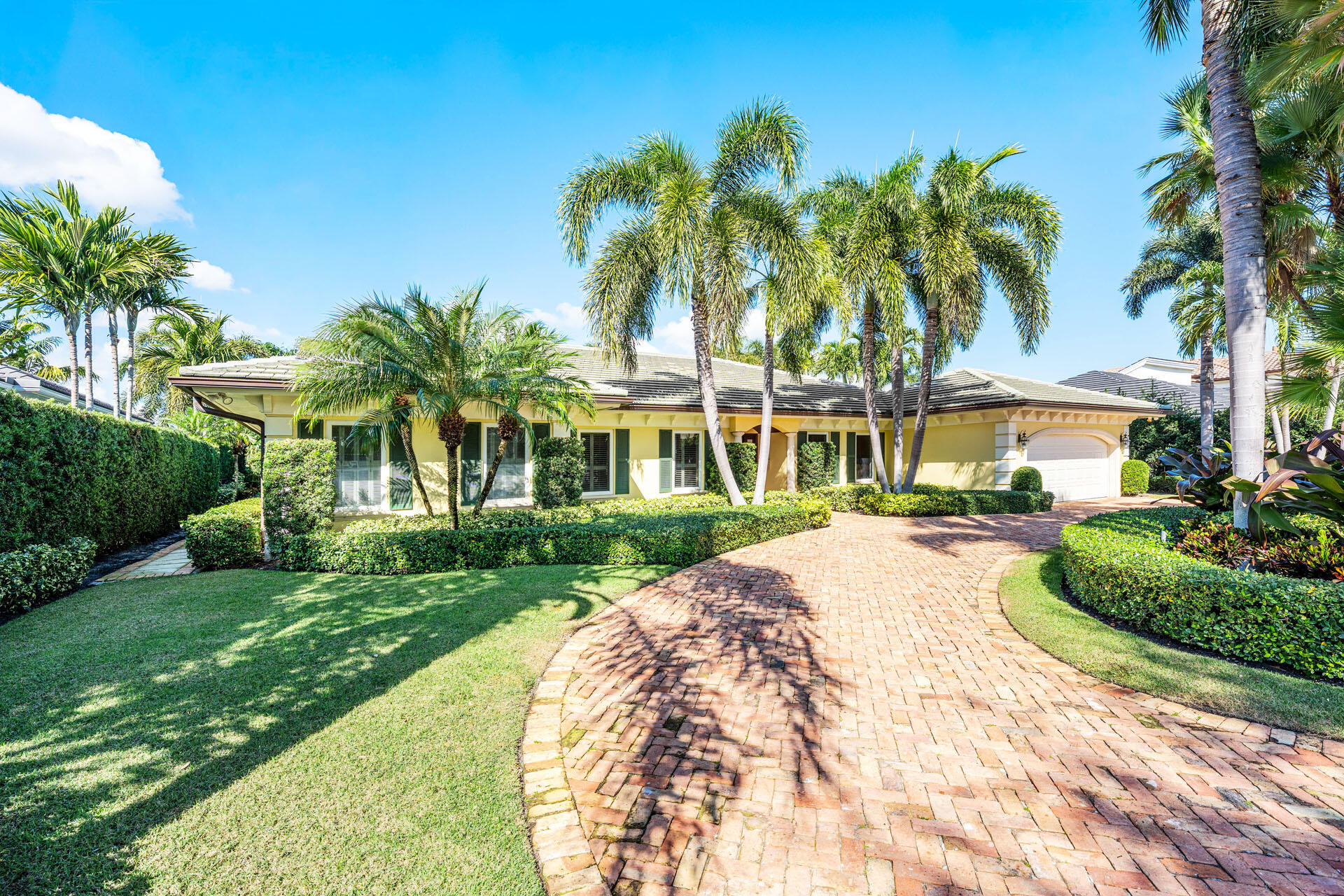 Set along the 3rd green of the Jack Nicklaus Signature Course, 1851 Thatch Palm Drive offers effortless single-story living with a serene golf course backdrop. Spanning over 2,400 square feet, the home is thoughtfully arranged with three bedrooms and two baths and is ideal for a home office or private retreat.
 
A brick-paver circular driveway and covered entry create a polished arrival, leading into light-filled interiors enhanced by plantation window coverings and seamless, step-free transitions throughout. The spacious primary suite enjoys tranquil pool views and a comfortable sense of separation, while the overall layout balances openness with privacy.
 
Outdoors, the gated backyard is designed for relaxed entertaining, featuring a custom heated pool and spa, along with a screened lanai complete with summer kitchen and lounge areaperfect for enjoying Florida living year-round. Additional features such as natural gas and a generator add peace of mind and everyday convenience.