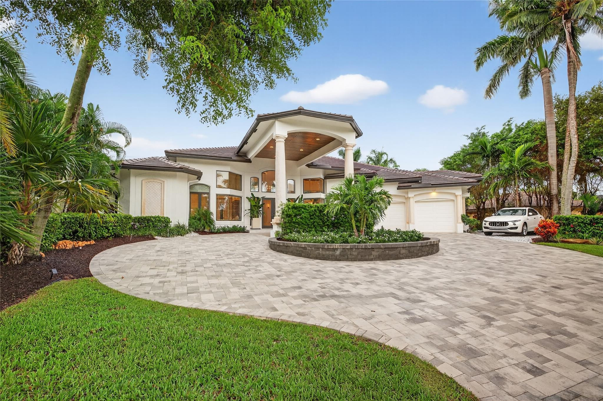 Rare opportunity to own a stunning & renovated SINGLE-LEVEL RETREAT in Fort Lauderdale's most prestigious guard-gated community. One of only 28 non-waterfront homes. Base flood elevation 9ft. Private marina just 180 ft away plus private beach club access across the street. Major renovations: new roof & A/C, exterior & interior paint, paved driveway, privacy fencing, wood ceiling accents, all-new appliances, oak & travertine flooring, , custom lighting,  new security system. Elegant entertaining spaces include a formal dining room, chef's kitchen, breakfast area with 14-16 ft ceilings & abundant natural light.  Primary suite features dual custom walk-in closets & spa style bath. Resort-style outdoor living offers covered seating area, fire pit, pool, waterfall, & lush tropical landscaping, Supplemental Information:* Award-winning interior design by Architectural Digest Pro Studio, Rendezvous Design *Additional updates: Smart sprinkler system & organic mosquito misting, Sonos system inside & out, water purification, keyless front door and partial window replacements, new garage flooring and slat wall storage system, hot water heater, attic insulation, all new interior and exterior door hardware