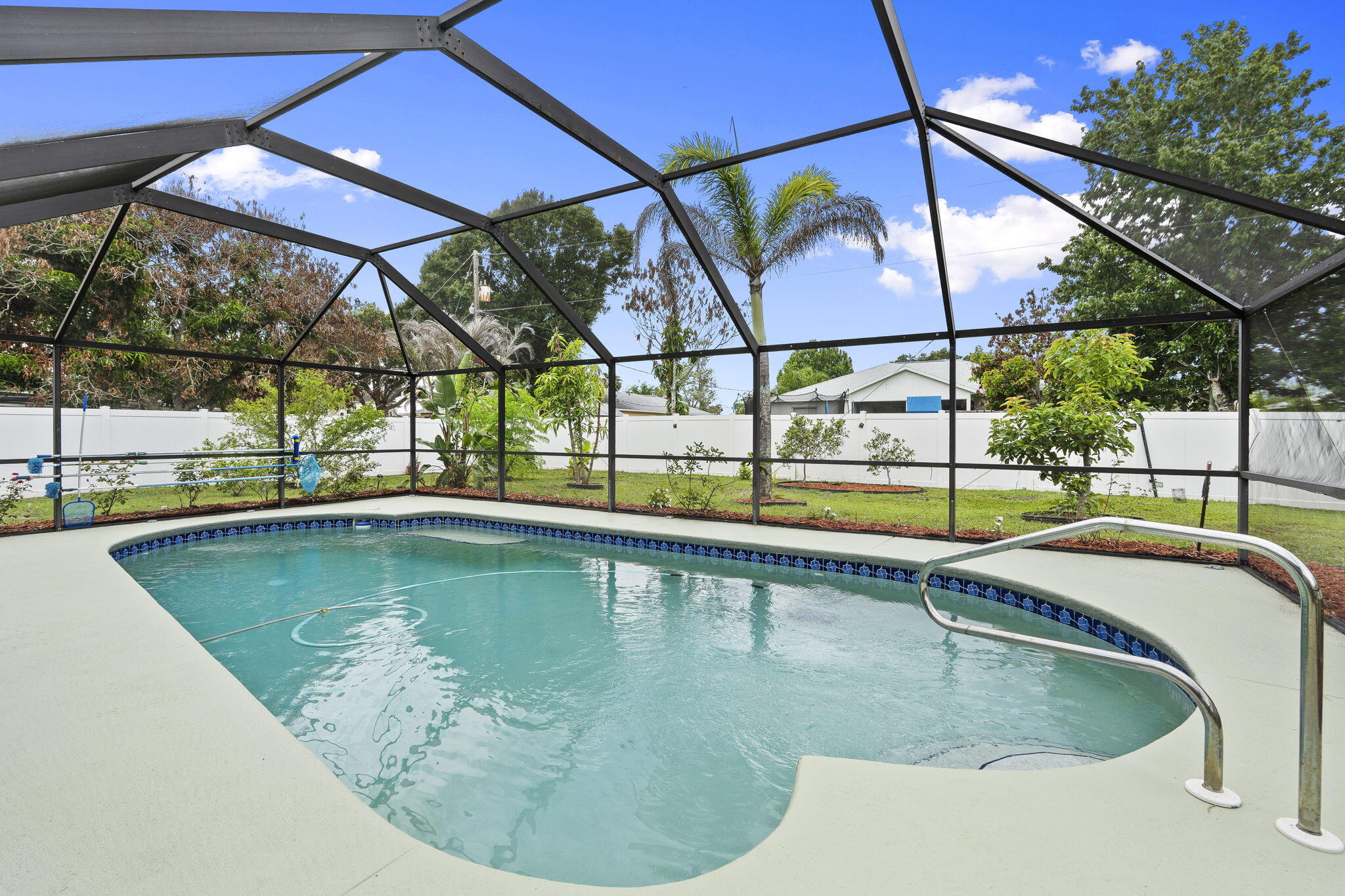 Charming, well-maintained, and move-in ready! Enjoy peace of mind with major updates already completed, including a newer: roof (2022), A/C and complete duct work (2023), and water heater (2024), washer and dryer (2025). This inviting home features a desirable split floor plan, a large covered and screened-in patio overlooking the pool, and a spacious vinyl-fenced backyard perfect for relaxing and entertaining. The property also boasts a variety of fruit trees and a water softener system. With its thoughtful layout, recent upgrades, and exceptional outdoor living spaces, this home offers the perfect blend of comfort, convenience, and Florida lifestyle. Don't miss your opportunity to make it yours!