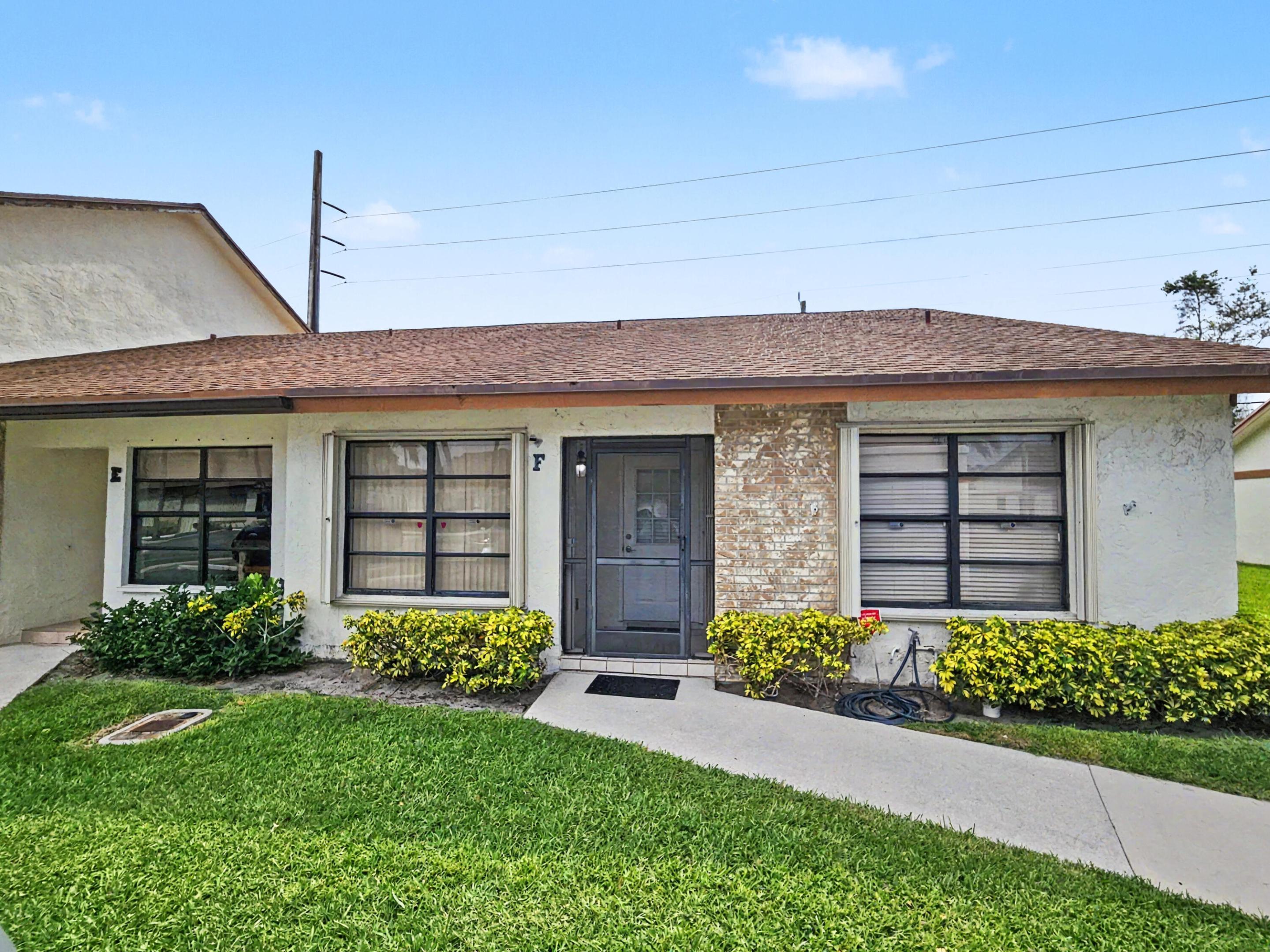Rare 3-bedroom corner-unit townhome in the highly sought-after Parkside Green community with low HOA fees. This light-filled home features soaring vaulted ceilings and an open layout that creates a spacious, airy feel. Enjoy both a screened patio with additional storage and a full-size washer and dryer, plus a second open patio perfect for relaxing in the Florida sunshine or entertaining guests. Freshly painted with modern updates and new ceiling fans, this home is move-in ready. The spacious primary suite offers a large walk-in closet and private ensuite bath, while two generously sized guest bedrooms share a full bathroom. Additional features include accordion hurricane shutters and two assigned parking spaces conveniently located directly in front of the home. More photos coming soon. The low HOA covers lawn care and maintenance of common areas plus residents enjoy access to a community pool and tennis courts. A rare opportunity to own one of the community's desirable 3-bedroom corner units!