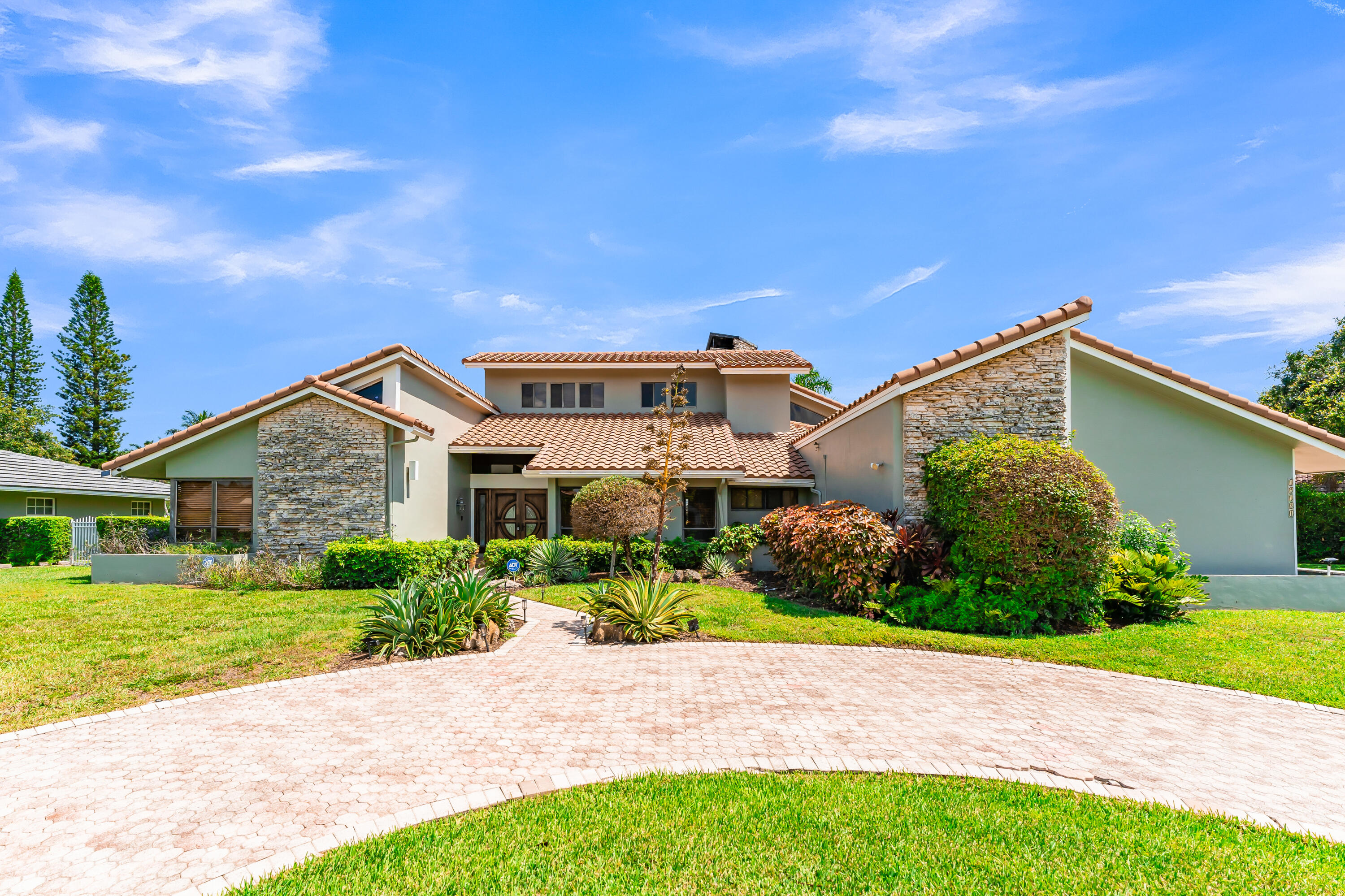 Rarely available in Lago Mar Colony Golf Community! Welcome to this charming home in the highly sought-after community of Plantation. Tucked away on a quiet, tree-lined street, this property offers a rare blend of timeless appeal and South Florida living with a unique, cabin-inspired charm.  Exuding warmth and character, this distinctive residence in Plantation showcases rich wood craftsmanship, a striking fireplace, and a refined, cabin-inspired aesthetic rarely found in South Florida. The main living area is anchored by a beautifully appointed fireplace. The private second-floor primary suite offers a serene retreat, adding a sense of separation and exclusivity to the home's layout. Conveniently located near major highways, shopping, dining, parks, and top-rated schools.