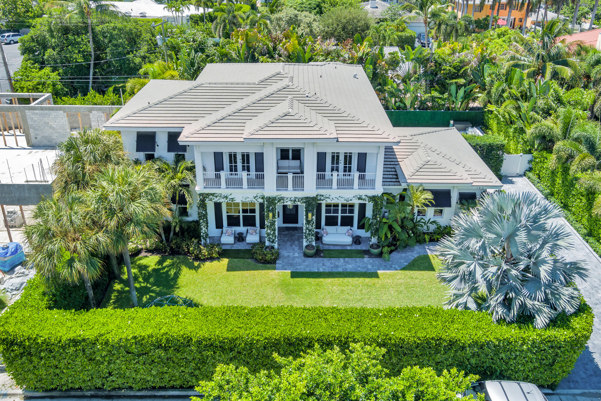 Built in 2020, this fully renovated  5 bedroom, 4.5 bathroom furnished home in SoSo offers refined style with every modern convenience. The main level features a formal living room, dining room, and family room, and opens to the gourmet kitchen offering Sub-Zero and Wolf appliances, a built-in coffee maker, wine fridge, oversized porcelain island, a conveniently located pantry, and a breakfast nook with a custom marble table. Upstairs, the primary suite offers a spa-like bathroom with a rainfall shower, Roman tub, private water closet, and a spacious walk-in closet. Custom light fixtures, designer finishes, and abundant natural light enhance the home's elevated style. Outdoors, a private backyard oasis awaits with a heated pool, built-in grill, outdoor TV, and lush landscaping. Ideally located just steps from South Flagler Drive and the Intracoastal, this exceptional residence offers the best of West Palm Beach living, just minutes from beaches, shopping, dining, and entertainment including The Park Golf Course, La Sirena, and Blue Door.