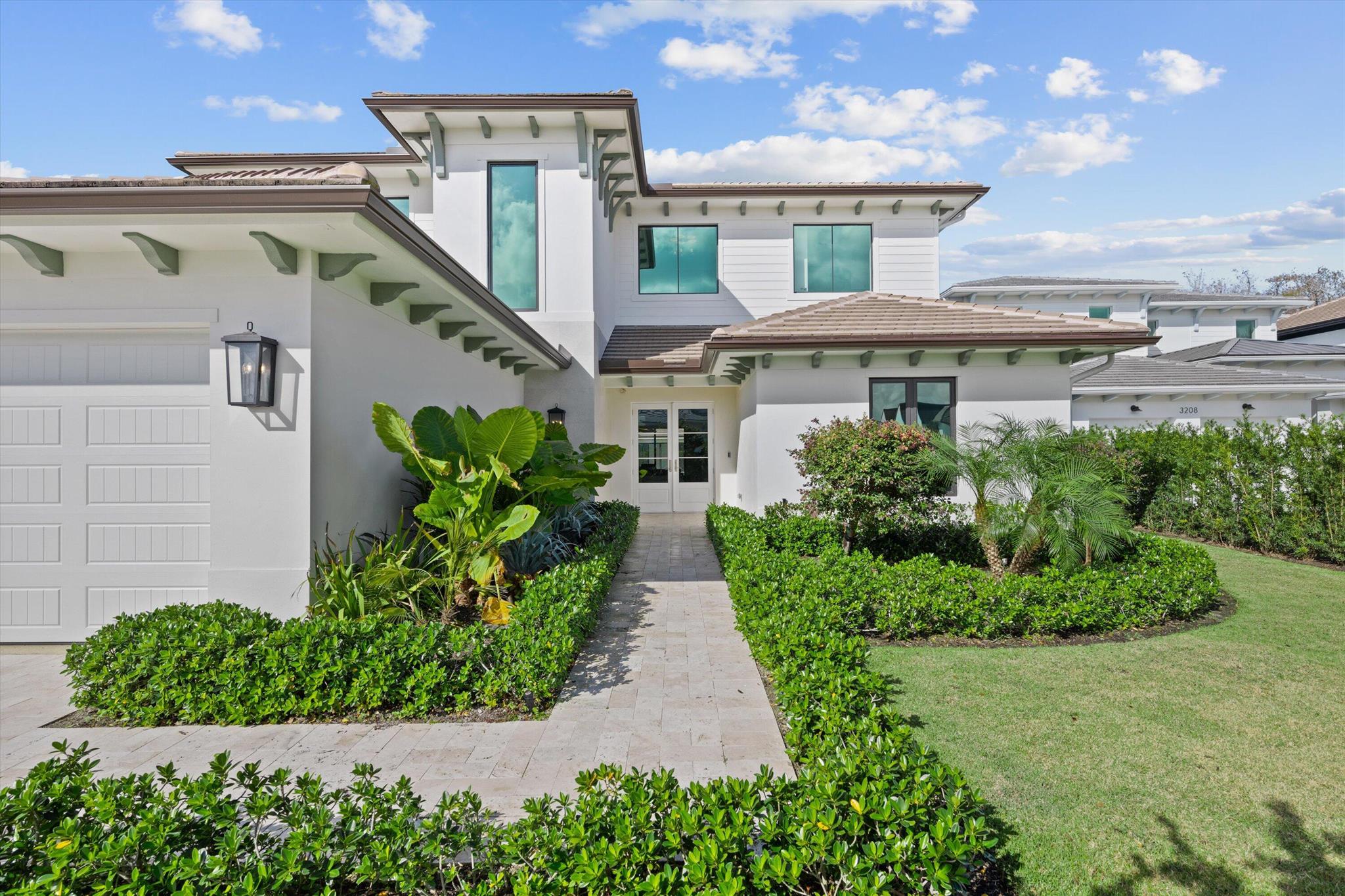 This new construction home is located in the coveted neighborhood of Blue Cypress within the private gates of Palm Beach Polo.  The modern, bespoke interior is warm and welcoming, boasting a main house with 5 bedrooms, 5 full and one half bathrooms, an exceptional outdoor space with a pool and a cabana guest suite. Outfitted with rich wood floors, volume ceilings with custom lighting, elegant wainscoted walls and countless other luxurious finishes, every detail has been carefully curated for a more refined way of living. The spacious kitchen offers a large waterfall center island with bar seating, Wolf and Subzero appliances, custom cabinetry and a walk-in pantry. The primary wing offers a spacious bedroom with private entry to the pool area, an oversized walk-in closet and a spa-like en suite with dual vanities, walk-in shower and freestanding tub. In addition to one guest bedroom on the first floor, the second level features 3 more guest rooms, all with en-suite bathrooms and walk-in closets. There is also a large loft with a wet bar and under-counter refrigerator, a media/game room, secondary laundry room and a generous balcony overlooking the backyard. With plenty of space for entertaining and relaxing, the outdoor living spaces include a covered patio and summer kitchen, pool and deck, plus a cabana house offering a full bedroom and bathroom.
