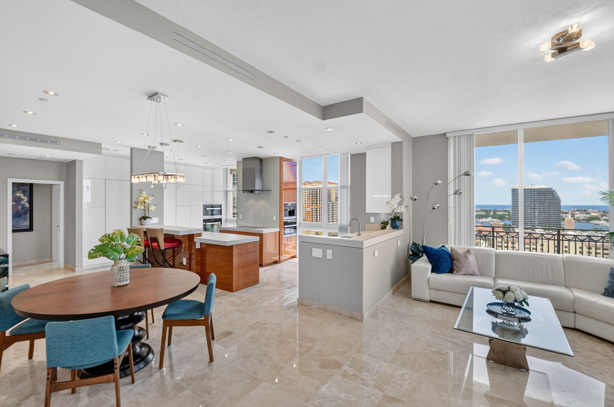 For the first time ever, this one-of-a-kind, extensively remodeled Penthouse is being offered for sale. Showcasing breathtaking direct east-facing views of the Atlantic Ocean and Intracoastal Waterway from nearly every room, this exceptional corner residence offers a level of luxury, privacy, and architectural uniqueness rarely found in Downtown West Palm Beach. A truly rare opportunity, this home features a dramatic double-wide kitchen expansion that immediately captivates from the moment you enter. The enlarged footprint creates a grand sense of scale, opening unobstructed sightlines from the living and dining areas and out to the wraparound balcony. There is simply no other floor plan like it in the building, a genuine 1-of-1 offering in the heart of Downtown West Palm Beach. Perfectly positioned on the coveted lower penthouse level, this residence combines sweeping water views with an unbeatable location in one of the country's fastest-growing luxury markets, now widely known as "Wall Street South." Two highly desirable garage parking spaces and a large private storage unit further elevate the value and rarity of this exceptional offering.  At the heart of the residence is an absolutely stunning, magazine-worthy chef's kitchen unlike anything else in CityPlace South Tower. Completely reimagined and expanded, this showpiece was designed with both luxury and functionality in mind. Custom cabinetry seamlessly conceals a full suite of integrated Miele appliances, including an extra-large refrigerator and a built-in Miele coffee system that brings the café experience home. Hardware-free push-to-open cabinetry, in-cabinet lighting, extensive custom storage solutions, and sleek designer finishes create a clean, sophisticated aesthetic, while custom tray ceilings and end-to-end recessed lighting provide a warm and inviting ambiance. Whether entertaining guests or enjoying a quiet morning overlooking the water, this extraordinary kitchen serves as the centerpiece of the home and is truly a chef's dream.  Designer sophistication continues throughout the residence with soaring 10-foot ceilings, expansive floor-to-ceiling windows and sliders, and a seamless connection to the oversized 400-square-foot wraparound balcony. Every detail has been thoughtfully curated, including a newer top-of-the-line Bosch air conditioning system that provides exceptional comfort and efficiency year-round. The result is a residence that perfectly blends luxury, comfort, and modern convenience while maximizing its stunning eastern exposure.  CityPlace South Tower is widely regarded as one of the premier luxury condominium buildings in Downtown West Palm Beach and stands out as perhaps the healthiest high-rise condominium community in the downtown market. With strong reserves, no special assessments, and virtually no maintenance fee increases for 2026, owners can enjoy an exceptional level of financial stability and peace of mind that is increasingly difficult to find.  Situated in the heart of booming Downtown West Palm Beach, residents enjoy immediate access to world-class dining, shopping, entertainment, and culture. Walk to the Kravis Center for the Performing Arts, Brightline, waterfront events, acclaimed restaurants, nightlife, and countless destinations that make downtown one of South Florida's most vibrant urban centers. The pristine beaches of Palm Beach Island are just minutes away, while the building is uniquely zoned for an A-rated elementary school district.  Downtown West Palm Beach is currently undergoing one of the most significant transformations in the nation. Billions of dollars in new investment are reshaping the city through the development of Class-A office towers, luxury hotels, expanded waterfront spaces, and acclaimed destinations such as Eataly, Milos, Harry's of New York, and numerous other high-end restaurants and retailers. The city is rapidly emerging as a major financial and academic hub, highlighted by the planned Vanderbilt University graduate campus and the continued influx of nationally recognized financial firms establishing offices and headquarters downtown.  This unprecedented level of investment is positioning West Palm Beach for sustained long-term growth, making ownership at CityPlace South Tower not only an exceptional lifestyle opportunity but also a compelling investment in one of South Florida's most dynamic and rapidly evolving markets. There is no question that West Palm Beach has captured national attention and firmly established itself at the intersection of luxury living, business, culture, and convenience.  Residents enjoy an exceptional collection of resort-style amenities, including 24-hour concierge service, valet parking, a state-of-the-art fitness center, designer club room, summer kitchen pavilion, and a spectacular resort-style pool and spa.  This extraordinary penthouse represents a rare combination of architectural uniqueness, luxury finishes, breathtaking water views, financial stability, and an unbeatable downtown location. Opportunities like this seldom come to market. Schedule your private showing today and experience one of the most distinctive residences in all of Downtown West Palm Beach.