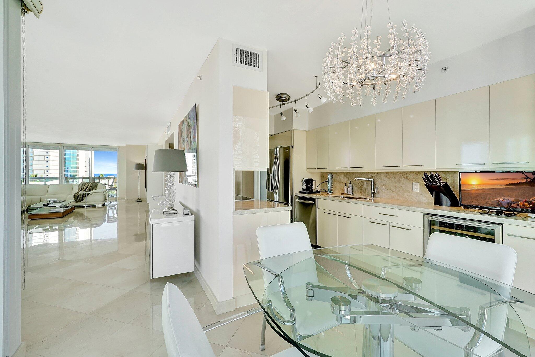 Mandatory Club fee of $5K per year, Restaurant fee of $1K. This stunning unit offers breathtaking, panoramic views and a huge wraparound balcony accessible from every room. Featuring two bedrooms, two bathrooms, and a spacious den, the residence boasts an expansive living area, a massive walk-in closet in the primary suite, a generous second bedroom, and a versatile den space. Additional conveniences include one storage unit and an assigned parking space. Live the ultimate resort-style lifestyle with exclusive access to the Oceania Club & Spa, located right on the beach. Amenities, including beachside service, two restaurants and bars, a state-of-the-art gym with classes, a full-service spa and salon, tennis courts, racquetball, and more.
