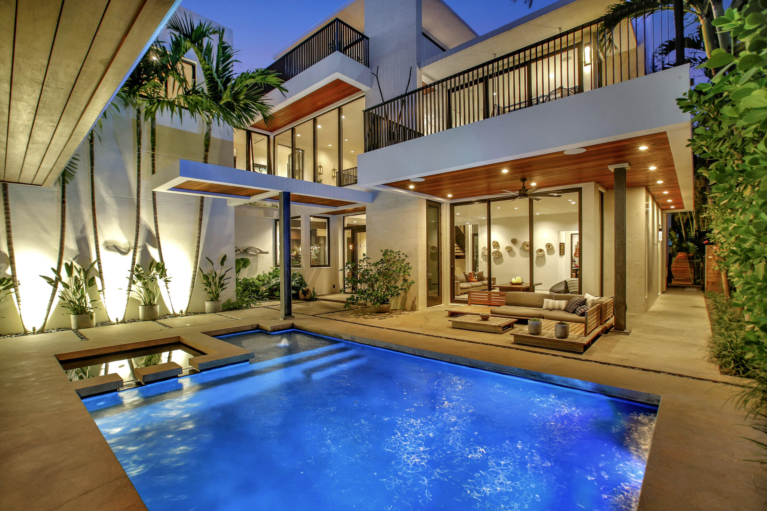 One of the Most Incredible Organic Modern homes to be found located in prestigious Hillsboro Shores and only a block to your private gated Beach.  The home has a Serene and Tranquil Bali Vibe with a material palette of Gorgeous Stones, Rich Woods and Glass.  Features a wide open floorplan, Polished concrete floors and a Custom Italian designed kitchen w/ Miele appliances. The Large great room w/ fireplace  has a seamless indoor-outdoor connection to the tropical pool and outdoor kitchen.  There is also a media room, Library and office. Upstairs is a flawless master suite w/ an Italkraft Closet, balcony and incredible bath. 3 other bedrooms complete the 2nd floor. The 3rd floor is true paradise with a huge patio and balcony and incredible views of the lighthouse and Gorgeous Beach area.