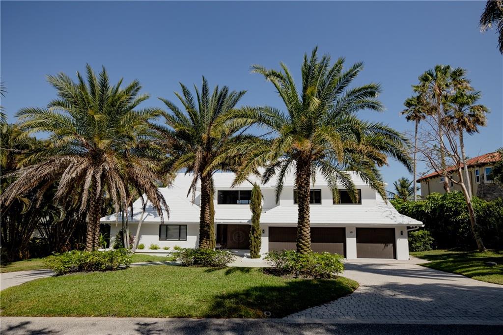This Gorgeous home is a four bedroom five and a half bathroom waterfront property with a stunning view of Stuart Inlet. This fully updated luxurious home boasts its 16-18 foot ceilings, storm glass impact resistant windows, new bathrooms, new kitchen with Carrera Marble & stainless steel appliances.  The entire home has been completely remodeled within the last 2 years from flooring to roofing; nothing was left untouched.  The property has a total of 105 feet of seawall and can accommodate a 70ft+ boat with no fixed bridges in sight.  The dock has running water & electricity along with a 20,000lb boat lift.  A private pool/jacuzzi, cabana bathroom along with an outdoor wet bar is the perfect place to entertain or relax and unwind with never ending views of the water and Stuart sandbar.