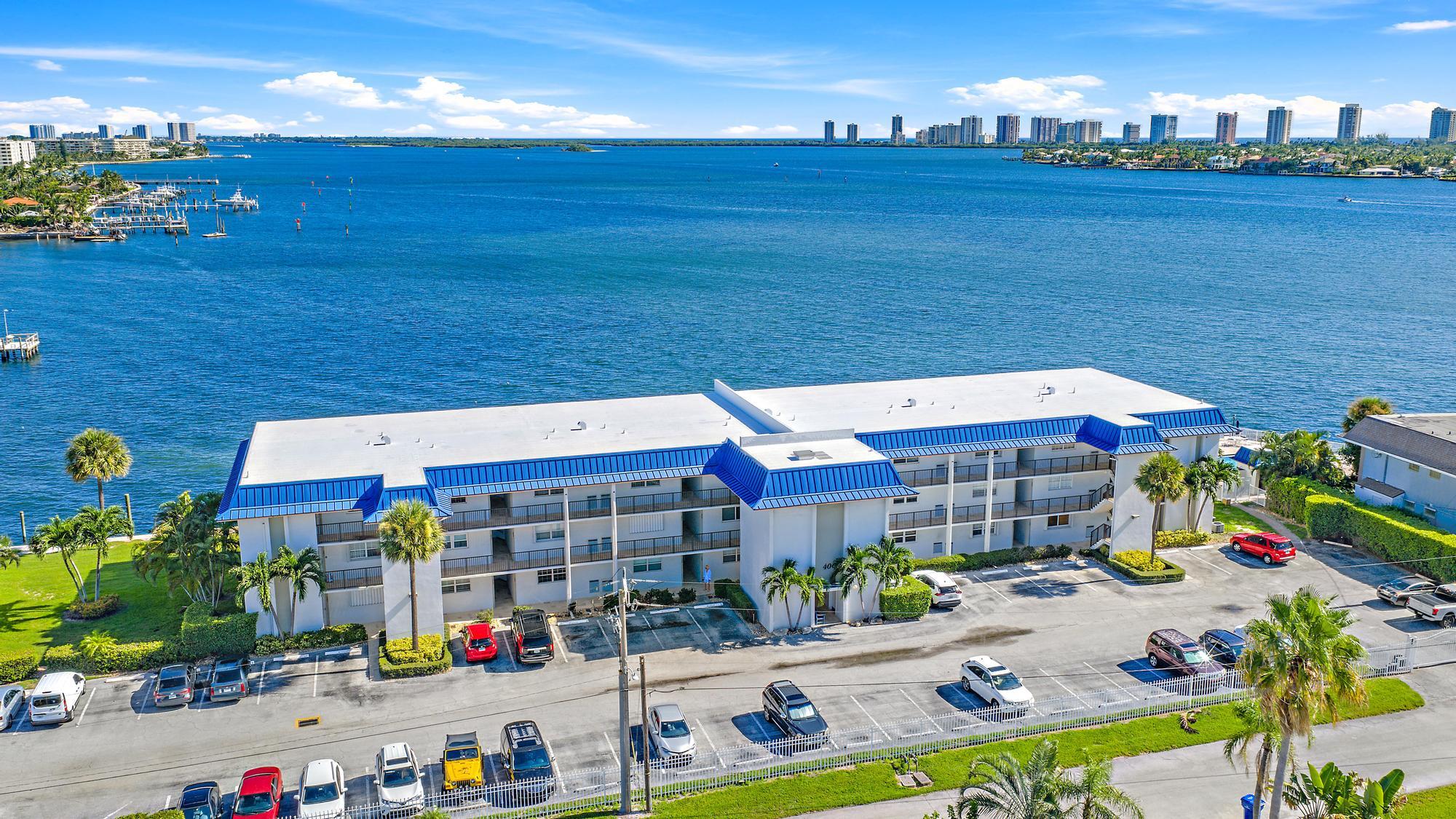 Enjoy easy waterfront living in this gated community with beautiful Intracoastal views. This first-floor condo features an open kitchen with granite countertops, ceramic tile throughout, and a bright, functional layout. Relax on the enclosed patio with peaceful water views, just steps from the waterfront pool. The community allows immediate rentals, making it a great option for both homeowners and investors. Easy parking right outside your front door and a prime location near Publix, dining, shopping, Singer Island beaches, and PBI Airport. Perfect as a full-time home, seasonal retreat, or investment opportunity.