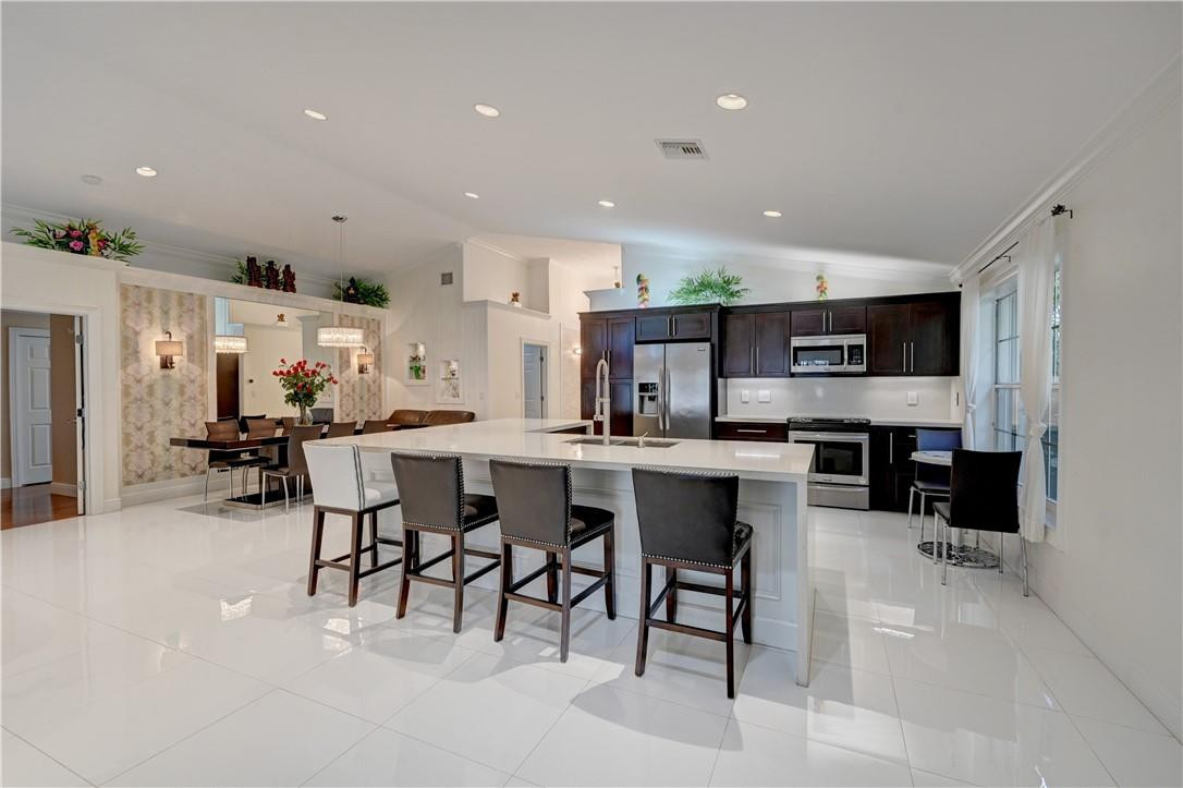 Amazing opportunity to own this Stunning 3/2 single family home in highly sought after Island @ Wyndham Lakes. This completely remodeled home greets you with a gorgeous foyer entry w/tile floors leading into the open concept dining/living room, updated eat-in kitchen w/Quartz counters, SS appliances & wood cabinets, crown molding thru-out, vaulted ceilings w/recessed lights, large laundry room (W/D excluded), updated guest bath w/step-in shower, laminate floors in bedrooms, Master suite boasts tray ceiling, His/Her California walk-in closet systems, dual sinks, separate Roman tub & shower, French doors lead out to the screened in patio. Walking distance to the Community pool & tennis courts. Close to Top-Rated Schools, shopping, dining & Sawgrass Amazing opportunity to own this Stunning 3/2 single family home in highly sought after Island @ Wyndham Lakes. This completely remodeled home greets you with a gorgeous foyer entry w/tile floors leading into the open concept dining/living room, updated eat-in kitchen w/Quartz counters, SS appliances & wood cabinets, crown molding thru-out, vaulted ceilings w/recessed lights, large laundry room (W/D excluded), updated guest bath w/step-in shower, laminate floors in bedrooms, Master suite boasts tray ceiling, His/Her California walk-in closet systems, dual sinks, separate Roman tub & shower, French doors lead out to the screened in patio. Walking distance to the Community pool & tennis courts. Close to Top-Rated Schools, shopping, dining & Sawgrass
