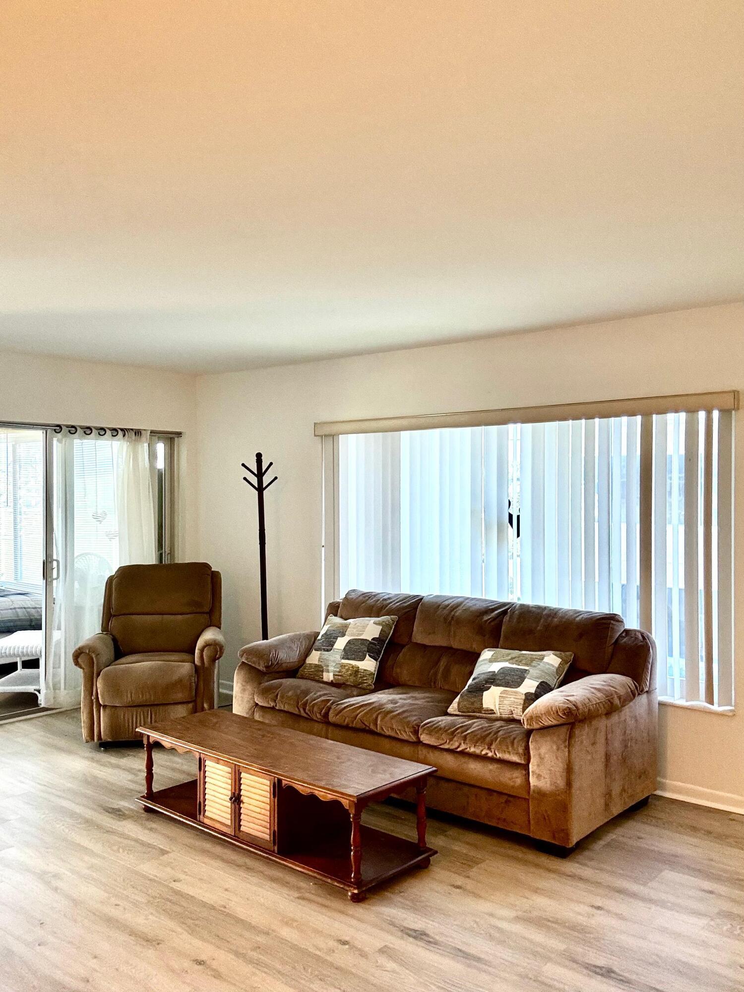 SPACIOUS, VACANT CORNER UNIT IN A DESIRABLE 55+ COMMUNITY. JUST 7 MINUTES TO THE BEACH AND 5 MINUTES TO I-95 BY CAR. MOVE-IN READY, AND PETS ARE WELCOME! THIS BEAUTY PASSED INSPECTION AND IS BACK ON THE MARKET. NESTLED IN THE HEART OF BOYNTON BEACH BETWEEN WOOLBRIGHT RD. AND S. SEACREST BLVD., THIS 2ND-FLOOR HOME OFFERS SERENE GARDEN VIEWS. NO ASSESSMENTS. NEW ROOF & EXTERIOR PAINT (2023) PLUS A BRAND-NEW A/C. LOW-RISE COMMUNITY WITH ONLY 2 STORIES. EACH UNIT INCLUDES ONE ASSIGNED PARKING SPACE, PLUS AMPLE GUEST PARKING. MAY BE RENTED AFTER 2 YEARS OF OWNERSHIP FOR A MINIMUM OF 90 DAYS OR AN ANNUAL LEASE. THE ENCLOSED PORCH IS IDEAL AS A BONUS ROOM OR READING NOOK. THE PRIMARY BATHROOM FEATURES A WALK-IN SHOWER. FURNITURE IS INCLUDED IN THE SALE.  LARGE STORAGE ROOMS ARE LOCATED BOTH INSIDE AND OUTSIDE THE UNIT. JUST STEPS FROM THE HEATED SPARKLING POOL, TIKI HUT, SHUFFLEBOARD COURTS, AND THE CLUBHOUSE LIBRARY. JUST 15 MINUTES FROM DOWNTOWN ATLANTIC AVE., FEATURING PREMIER SHOPPING, DINING, AND ENTERTAINMENT. CONVENIENTLY LOCATED NEAR WHOLE FOODS, PUBLIX, ALDI, TRADER JOE'S, WALMART, BANKS, AND EVERYDAY ESSENTIALS. SCHEDULE YOUR PRIVATE SHOWING TODAY!