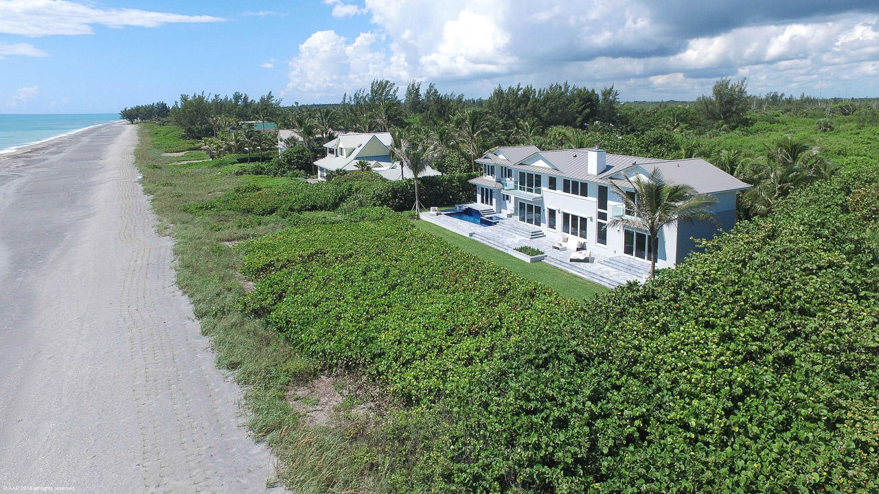 This beautiful brand new four bedroom, five bath contemporary built to the highest construction standards sits on 150’of pristine, private beachfront and features a spacious open floor plan. There are wide, unobstructed views from every room on the first and second floor. Downstairs, a luxurious spa area includes a sauna and expansive yoga/exercise/meditation spaces.  A one bedroom guest cottage with a separate sitting room make this the perfect Island getaway for family and friends.