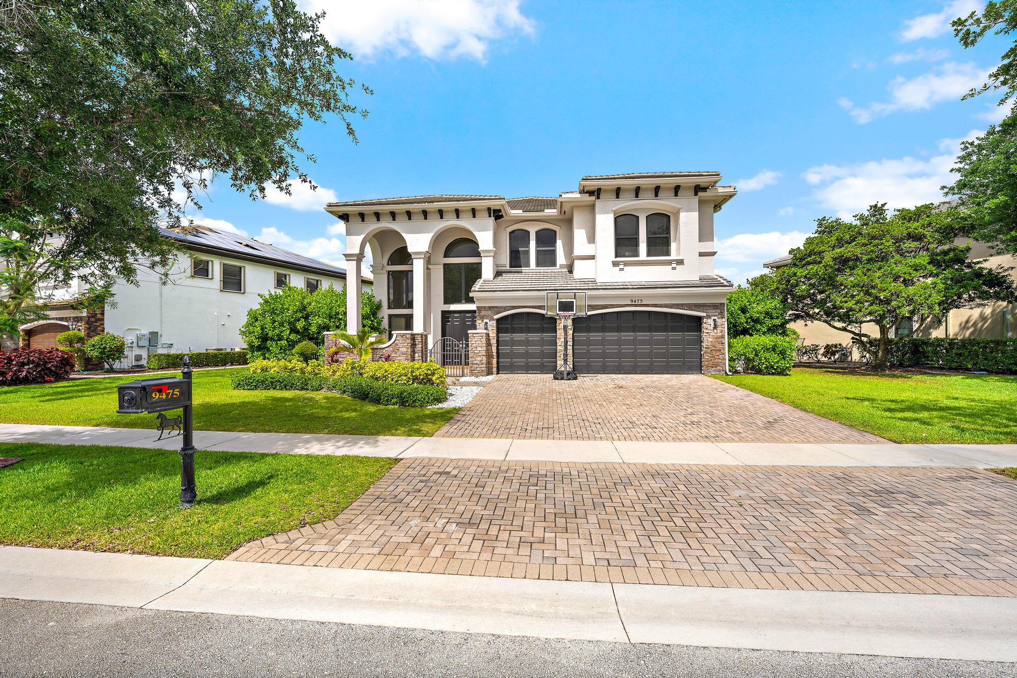 Beautifully remodeled 5-bedroom plus office which can be converted back into a 6th bedroom, 5-bath estate in the prestigious community of Equus. This impressive home features polished porcelain flooring throughout, a renovated chef's kitchen with separate refrigerator and freezer, double dishwashers, natural gas range, and high-end finishes. Imported Italian doors, designer lighting, extra ceiling lighting, and a modern glass-railed split staircase add style and sophistication throughout the interior. Recently repainted outside and surrounded by lush tropical landscaping, the home sits on an oversized pie-shaped lot overlooking a sparkling lake. A rare opportunity to own a turnkey lakefront home in one of Equus's most sought-after communities.