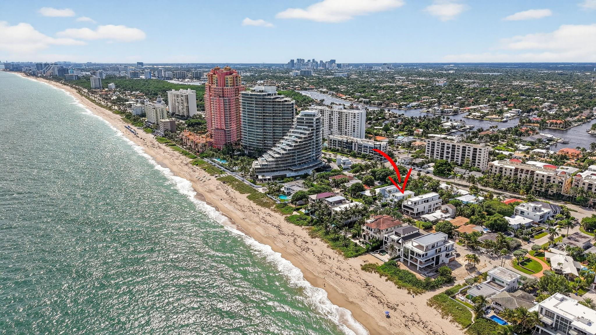Literally across from the beach! Now offered below REPLACEMENT VALUE!  Located in highly desirable Lauderdale Beach, the unknown locals beach & perfect oceanside village offers walkability to local restaurants, nearby Publix & shopping. Enjoy 3 levels of luxurious oceanside living on one of few oversized/deep properties allowing privacy to large garden & pool area. Summer kitchen for outdoor entertaining.  The lower level includes a large entry foyer, VIP suite, office or gym & two secondary bedrooms. Elevator & stair access to open concept living areas. large chef's kitchen, living room & media area, covered balconies on 2 sides. The primary suite enjoys total privacy on the third level with custom closets, spa-style bathroom & two private balconies. Potential seller financing.