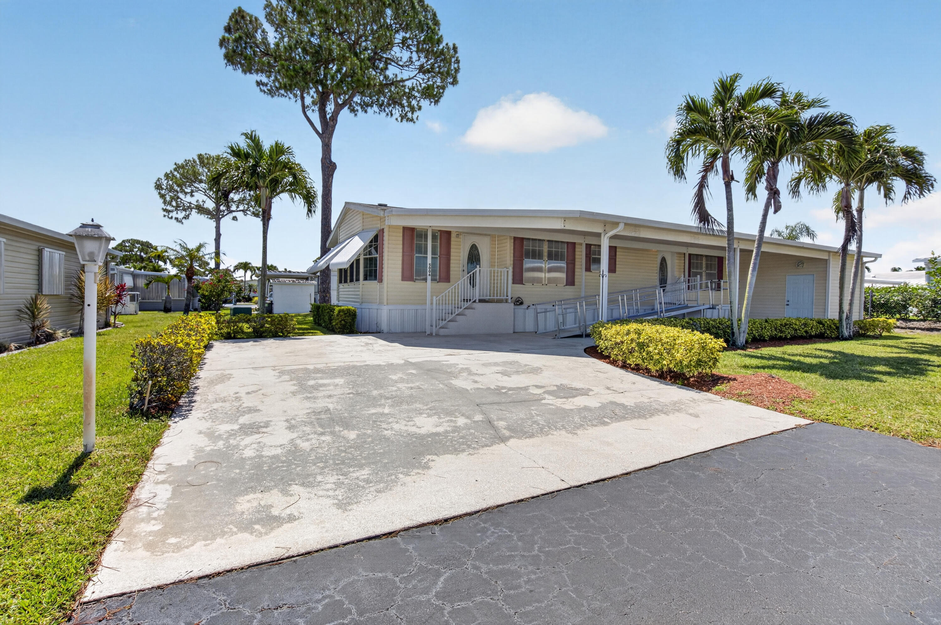 Beautifully maintained 2012 manufactured home offering over 1,690 sq. ft. of comfortable living space with 3 bedrooms and 2 bathrooms. Featuring a  2025 A/C, upgraded GE appliances, crown molding, 39 tie downs, hurricane resistant windows and drywall throughout.    Situated on an oversized corner lot, with additional parking space, the property offers exceptional outdoor space and privacy. The home is being offered fully furnished and was recently professionally cleaned and organized, making it truly move-in ready.  Jamaica Bay is a 55 and over community with multiple heated pools, clubhouse, billiards, shuffleboard, 2 pickleball courts, library, social activities and a new onsite convenience store!