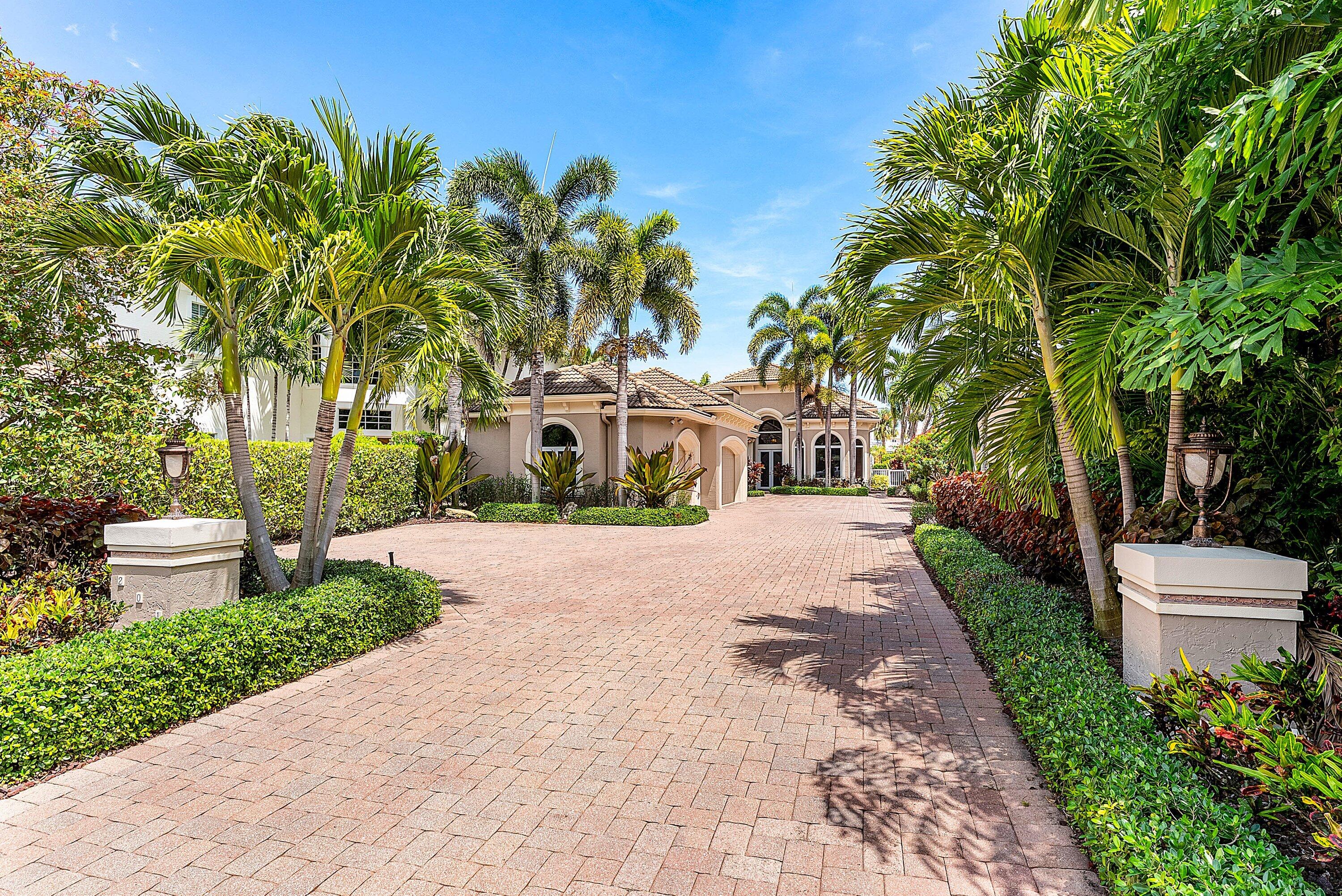 Experience unparalleled waterfront living in this stunning Jupiter estate on the Intracoastal with direct ocean access for boats with no fixed bridges. Boasting 4 spacious bedrooms, 3 bathrooms, and just under 4,000 sq. ft. of luxurious living space, this home perfectly blends elegance and comfort. Enjoy breathtaking water views from multiple rooms, a chef's kitchen with high-end appliances, and expansive living areas ideal for entertaining. The private dock with lift offers effortless boating, while the outdoor living spaces include a pool/spa and summer kitchen, providing a serene retreat for relaxation or gatherings. This one-of-a-kind luxury residence showcases exceptional custom upgrades throughout. Features include hurricane impact windows with plantation wood shutters, elegant crown molding, a tankless water heater, and a central vacuum system. Car enthusiasts will appreciate the expansive, high-end 4 car garage, while bibliophiles will be captivated by the custom library crafted in rich red cherry wood. The palatial master suite conveniently located on the first floor offers a spacious spa tub, and the home is accented with custom lighting and a stunning staircase made of maple wood, reflecting unparalleled craftsmanship. Every detail has been thoughtfully designed to combine functionality, elegance, and timeless luxury. Located in one of Jupiter's most desirable neighborhoods, this property combines waterfront lifestyle with easy access to the finest dining, shopping, and beaches.