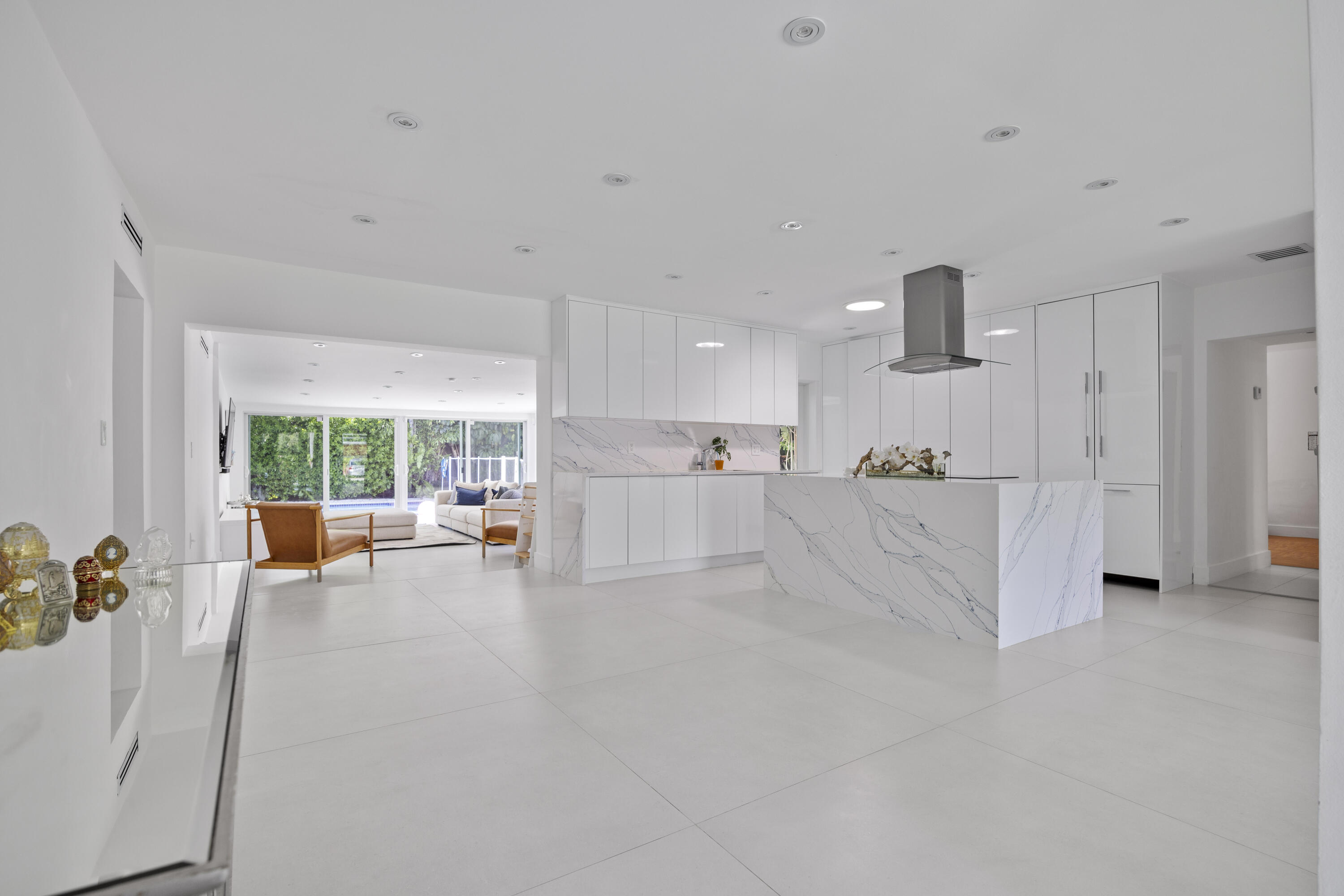 Turnkey and move-in ready for August: a beautifully renovated single-story home in Key Biscayne, set on a private 7,500 sq ft lot. 4 bedrooms, 3 full bathrooms across approximately 2,400 sq ft of bright, open living space. Floor-to-ceiling glass doors connect the living area to the terrace and heated pool — enjoy it year-round. Open kitchen with island, walk-in closets, and solar panels that help reduce electricity costs. Available fully furnished (turnkey) or unfurnished upon request. No age restrictions, no HOA, Beach Club access. Close to Key Biscayne K-8. Available starting 08/01/2026. Showings by appointment only. Built in 1951, renovated two years ago. Residential zoning, Biscayne Key Estates subdivision. Private in-ground pool with equipment included, fenced. Parking: driveway + paver block, 4 open spaces, no garage. Complete storm protection (impact glass). Roof type "Other" — please confirm details with listing agent. Fencing: fenced back yard. Additional structures: pergola and shed. Multiple dining areas: eat-in kitchen, family/dining combination, formal dining, snack bar/counter — ideal for entertaining. Interior features: custom mirrors, entrance foyer, pantry, additional storage. Security: CCTV cameras and smoke detectors.