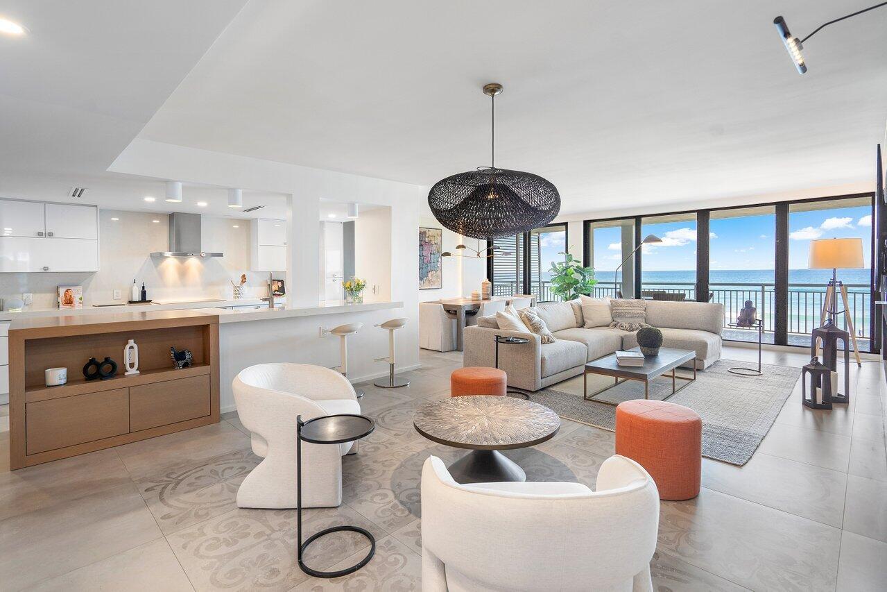 Totally renovated, reconfigured, and reimagined to create the ultimate direct ocean front 3 bedroom, 2 bath residence with direct east, south and westerly water views from within and on the wrap around spacious balcony which creates a second living area.  Fully furnished with Sophisticated, chic, and a beautiful neutral pallet of designer furniture and furnishings.  Open kitchen with an induction oven top, porcelain tile flooring throughout, hurricane impact sliding doors, spacious laundry room, bar, and a special vapor fireplace in the living area.  PLUS a poolside cabana that is enclosed with hurricane impact doors, open kitchen, full bath and storage area.  The Cabana is perfect for an office/den and easy access to the resort style pool and wide expansive beach . 2600 is completing an extensive restoration and renovation of the pool area, fitness center, and common areas.  All slated to be ready for the holiday season.  Pool, Beachside service with cabanas on the sand, hard tru tennis courts, gated security, full time manager, and Pet friendly!  This is the ultimate "turn key" residence as offered fully furnished and move in ready!