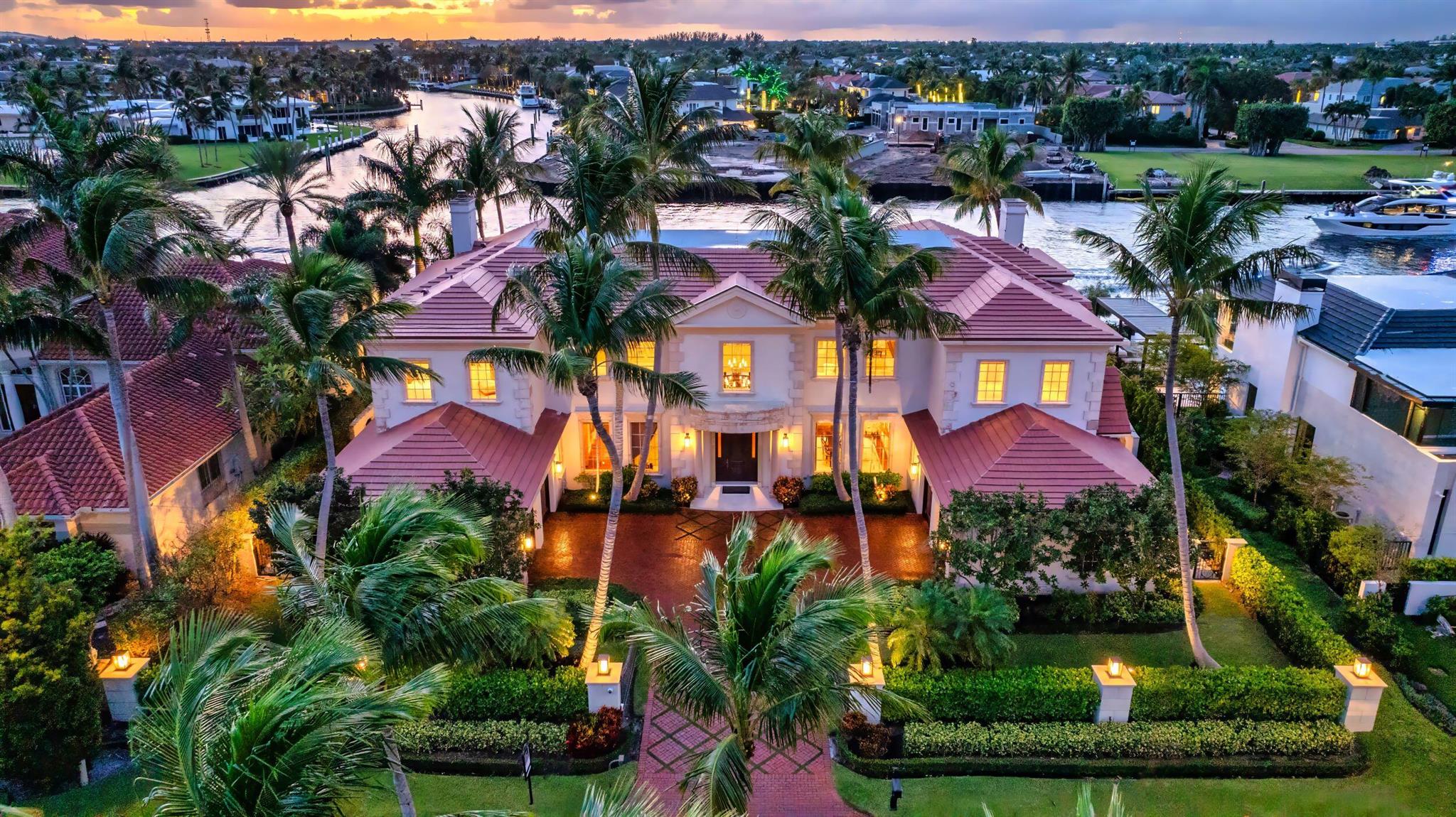 Gated Palm Beach-inspired Tropical Georgian sited on 123 +/- feet of Intracoastal with wide views overlooking Royal Palm's Grand Canal and originally built by acclaimed Frankel Estate Homes, Carlos Martin Architects, and interiors by Marc-Michaels. An elegant and graceful staircase with N/S Gallery sets the stage for this high- styled Intracoastal mansion with all public rooms facing the waterway. Grand salon with adjacent club room and pub. Modern gourmet kitchen opens to a breakfast and family room. Luxurious Primary suite features a lounge/retreat with fireplace, dual spa-like baths, walk in closets and two balconies. Outdoor entertaining is enjoyed at the elegant pool/patio, grand lanai with fireplace, separate pavilion with summer kitchen for alfresco dining. Shown by appt only DISCLAIMER: Information published or otherwise provided by the listing company and its representatives including but not limited to prices, measurements, square footages, lot sizes, calculations, statistics, and videos are deemed reliable but are not guaranteed and are subject to errors, omissions or changes without notice. All such information should be independently verified by any prospective purchaser or seller. Parties should perform their own due diligence to verify such information prior to a sale or listing. Listing company expressly disclaims any warranty or representation regarding such information. Prices published are either list price, sold price, and/or last asking price. The listing company participates in the Multiple Listing Service and IDX. The properties published as listed and sold are not necessarily exclusive to listing company and may be listed or have sold with other members of the Multiple Listing Service. Transactions where listing company represented both buyers and sellers are calculated as two sales. Some affiliations may not be applicable to certain geographic areas. If your property is currently listed with another broker, please disregard any solicitation for services. Information published or otherwise provided by seller, listing company or its representatives is deemed reliable but are not guaranteed and subject to errors, omissions, or changes without notice. Copyright 2024 by the listing company. All Rights Reserved.