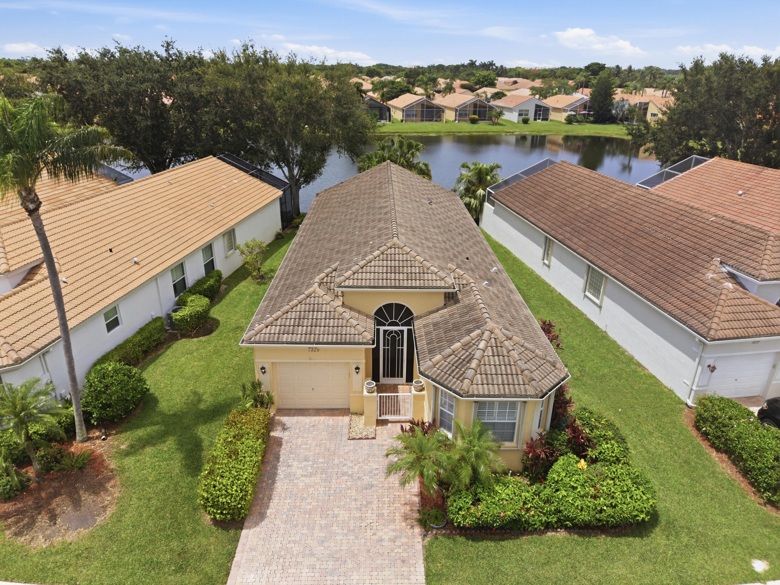 Enjoy the best center lake  views  in Vizcaya, a desirable active 55+ gated community! This beautifully maintained, fully furnished home  offers 2  bedrooms, 2 bathrooms, plus a versatile den that can serve as a home office or third bedroom. Tile flooring flows throughout the home, while the eat-in kitchen features granite countertops, abundant cabinetry, and stainless steel appliances. Additional highlights include ac 2021  a separate laundry room, accordion hurricane shutters, and a spacious screened patio overlooking the community's most scenic views. Residents enjoy resort-style amenities including a clubhouse, swimming pool, tennis courts, pickleball, and a vibrant social calendar, making this the perfect place to enjoy the Florida lifestyle. Schedule on Showing time. AC 2021, water tank 2017, furnished except for personal items and ornaments.  Buyer pays HOA  Transfer fee 3x the HOA monthly fee.