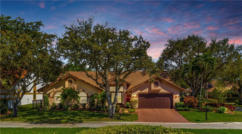 ONE STORY HOME IN EAGLE TRACE / EAGLE POINT, A CUSTOM MODEL, FIVE-BEDROOMS, TWO ½ -FULL BATHS, 2-CAR GARAGE, PROBABLY THE BEST LOOKING MOST UPGRADED HOME IN THE SUBDIVISION,  CORAL WOOD BURNING FIRE PLACE, SCREENED IN PATIO, VERY PRIVATE OVER-SIZED SOLAR HEATED POOL WITH A COVERED AREA,  5TH BEDROOM IS CURRENTLY SET UP AS AN OFFICE / STUDIO, UPGRADED EXPANDED KITCHEN WITH GRANITE &  NEWER APPLIANCES,  UPGRADED EXPANDED MASTER BEDROOM WITH WALK-IN CLOSET  & SITTING AREA,  A DESIGNER’S MASTERPIECE, VOLUME CEILINGS, CROWN MOLDING,  EXTRA STORAGE, MARBLE & TILE FLOORING, HURRICANE SHUTTERS, HOA IS ONLY $236. PER. MONTH INCLUDES 24 HOUR GUARD GATED AND ROAMING SECURITY, TENNIS CLUB, PICKLE BALL, BASKET BALL, AND TOT LOT, MANAGEMENT ON SITE.  NOT A SHORT SALE OR FORECLOSURE A QUICK & EASY CLOSE. A rare find, an outstanding value, in one of Coral Spring’s finest communities. Beauty in highly desirable Eagle Trace / Eagle Point with probably the best keep, best maintained, and best looking home in the subdivision.  This is a custom model, and this is your chance to purchase a very exciting Five-bedroom with two ½ - full baths; one-story corner lot property with two-car attached garage pool home. A triple split bedroom plan with the Master on one side and three bedrooms and bath on the other. Fifth bedroom is currently set up as an office/ studio.  This home has been up-graded on the interior and exterior with all the good stuff. To include  newer AC with UV lights, newer hot water heater, newer pool pump with salt water system, solar pool heater, HURRICANE SHUTTERS, newer lighting, and fixtures, custom newer paint inside and out, and crown modeling.  A designer’s masterpiece, nothing has been left undone in this one of a kind home. A large well kept fenced lot with thousands of dollars spent in beautiful lush landscaping. An over-sized screen enclosed patio covers the large pool and the pool area also has a covered patio. Very large formal living room with formal dining room with an open floor plan with volume ceilings and marble and tile floors.  Wood burning coral limestone fireplace, Neutral colors, custom paint, spotlessly clean very light and bright. Master bedroom has a sitting area with a large walk-in closet. Master bath has separate shower, Roman tub, and a cabana bath.  There is lots of extra storage throughout the home and in the garage.  Items included are the Washer and Dryer, Range, Microwave, Dishwasher, Refrigerator, pool cleaning tools-Auto Pilot Pool Pilot, and automatic garage door opener with a remote. All of this in an extremely well maintained Golf Course, Gated community, within close walking distance to parks and schools. You can get to I-95 the Turnpike and Sawgrass in minutes. This quaint bed and bath community is conveniently located near shopping, dining, and entertainment. The intimate and friendly neighborhood is also just minutes from airports and the Beaches. Nestled on a quiet street, this property has a spacious lot and is very private.   The owner’s attention to detail has made this unit, “ready to go”, move in condition. With the best of everything, move-in to this exceptionally maintained home in the Heart of Eagle Trace / Eagle Point.  If you are looking for a very private yet spacious home in one of Coral Spring’s most sought after communities, look no further and make an offer.  HOA is only $236. a month and includes 24 hour 7 days a week guard gated and roaming security, also a tennis club, pickle ball, tot lot and basket ball courts, management on site.  Not a Short Sale or Foreclosure. This is a quick and easy close.