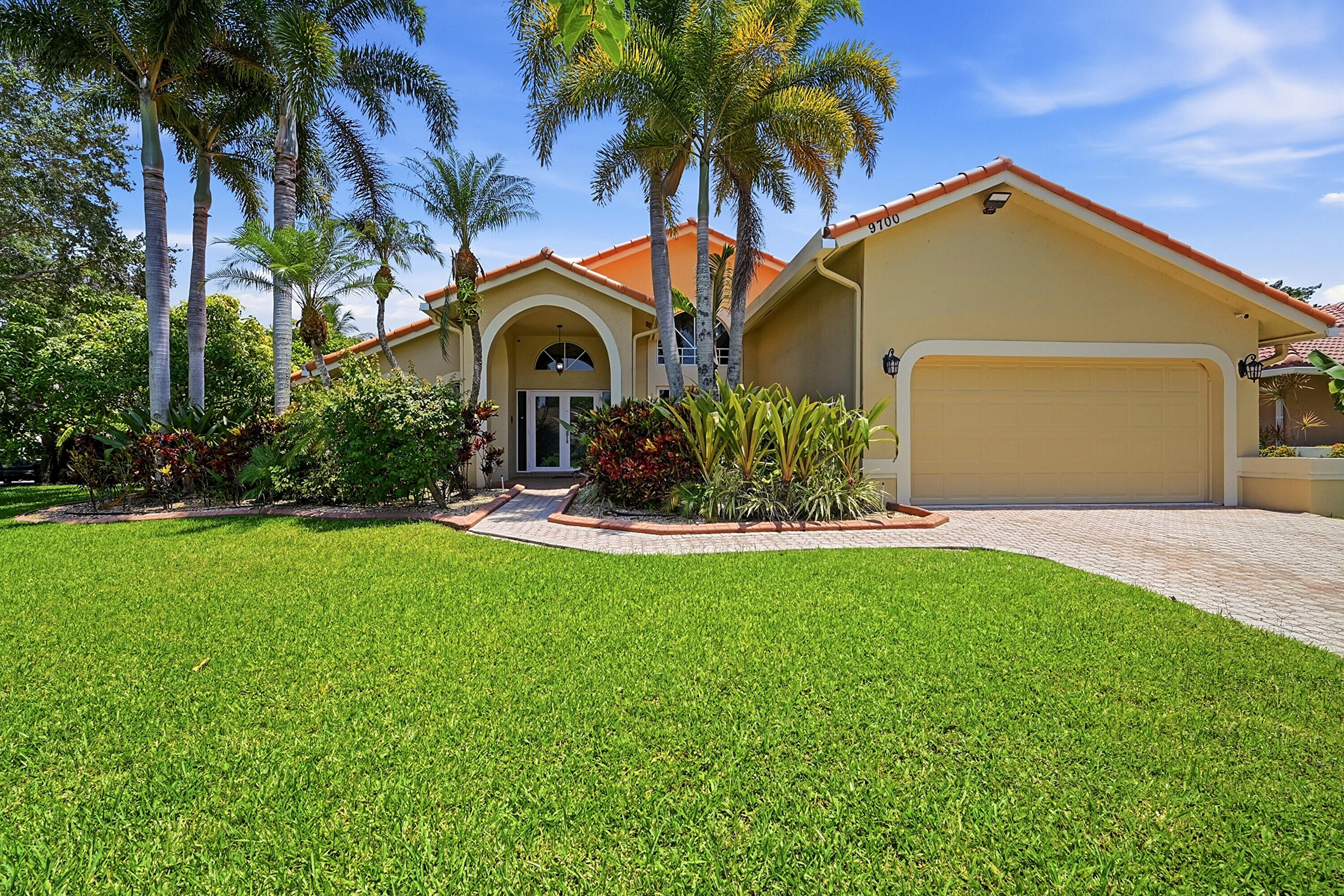 Situated on an oversized 13,289-square-foot waterfront lot, this five-bedroom, three and a half-bathroom home offers space and flexibility. The split floor plan provides room for family, guests, a home office, or multi-generational living.  It has a solar heated pool, large screened lanai,  private backyard and peaceful water views. Mature fruit trees, including several types of mango, jack fruit, golden apple, sapodilla, coconut & cashew. The kitchen features granite counters and stainless steel appliances, new dishwasher, new oven/microwave, mahogany wood flooring and marble tile throughout. The home has partial impact windows and doors 2023, back sliders have accordion shutters, roof 2006, HVAC 2020. No HOA