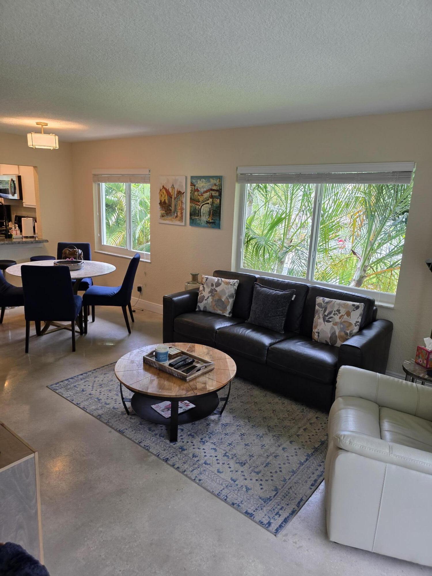 A Rare Opportunity where owners don't often sell. Enjoy quiet, comfortable living in this highly desirable corner unit filled with abundant Florida sunshine, a thoughtfully designed 2-bedroom, 1.5-bath condo located in a hidden gem community, just minutes to the beach and shopping. 841 sq ft across on a 2nd floor, this residence offers efficient use of space with well-appointed rooms ideal for modern living. This condo provides distinct separation between living and sleeping areas, maximizing privacy and functionality. This unit presents a rare yet excellent opportunity for those seeking a practical, well-structured home in a peaceful retreat. Bedroom furniture is negotiable and ideal for a turnkey move-in at a very reasonable offering. Several upgrades and a very well-maintained unit.