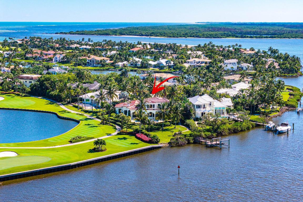 Water, water everywhere! This magnificent Sailfish Point residence showcases timeless elegance and masterful craftsmanship throughout. Enjoy sweeping views of the St. Lucie River and golf course from most rooms. The grand interior features a stately dining room with decorative columns, a gourmet kitchen with glazed cabinetry, granite countertops, and top-tier appliances.
The luxurious master suite offers a private retreat with intricate moldings, a private sitting area, and breathtaking intracoastal and golf course vistas. Perfect for entertaining, the home includes three elegant guest suites, a wet bar, a butler's pantry with a second dishwasher and wine storage, and a covered patio with travertine floors and a summer kitchen. and a spacious 2.5-car garage, all set on a 0.88-acre cul-de-sac lot. Dock with lift. Can accommodate up to 64' boat