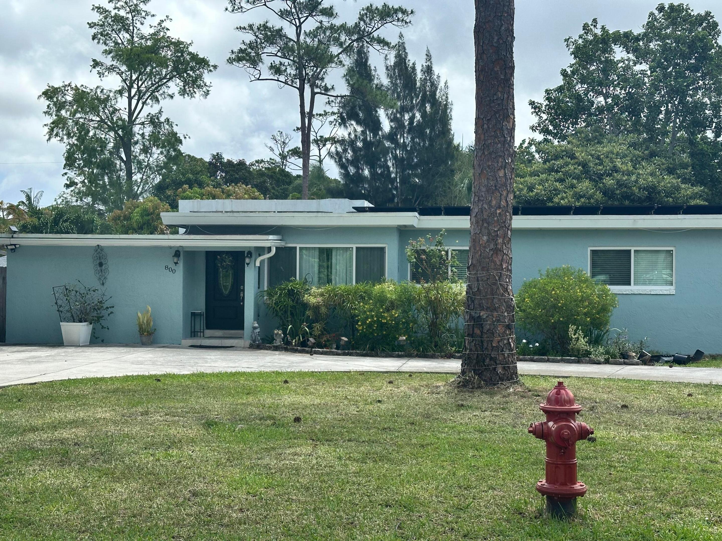 Beautifully updated 4-bedroom Mid-Century Modern pool home located on a large private lot with NO HOA. Originally built in 1953, this home blends timeless architectural character with stylish modern upgrades and exceptional outdoor living. The updated kitchen features shaker cabinetry, quartz-style countertops, stainless steel appliances, designer lighting, and an open-concept layout overlooking the main living area. Warm wood ceilings add charm and architectural character throughout the home.  Step outside to your private backyard oasis featuring a recently resurfaced pool with new tile, expansive patio space perfect for entertaining, tropical landscaping, ambient lighting, and plenty of room to relax or host gatherings. The oversized fenced backyard also includes a storage shed and ample green space.  The converted garage provides a flexible 4th bedroom, guest room, office, gym, or bonus space.This bedroom includes a dedicated space for the addition of a 3rd bathroom. Conveniently located near shopping, dining, schools, and major roadways while offering freedom and flexibility with no  restrictions.**Solar panels will be paid off by seller at closing, giving the new owner the benefits of energy savings with no additional loan or lease obligation.