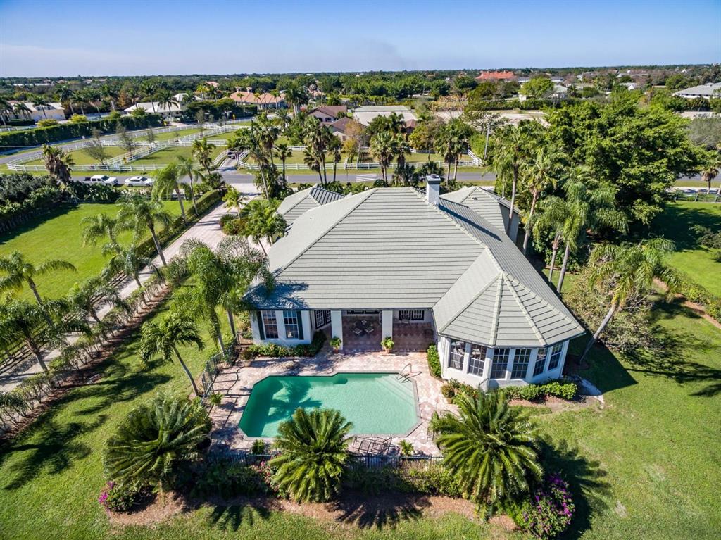 The lowest priced property in desirable Saddle Trail Park South, this just over 5-acre estate offers so much potential. Within a 5 minute hack to the Winter Equestrian Festival showgrounds. This private equestrian estate comes complete with pool, 6 paddocks, riding ring, 5-stall barn, tack-room, and feed area.  The lot size allows for the construction of a 20-stall barn with 5 grooms quarters.