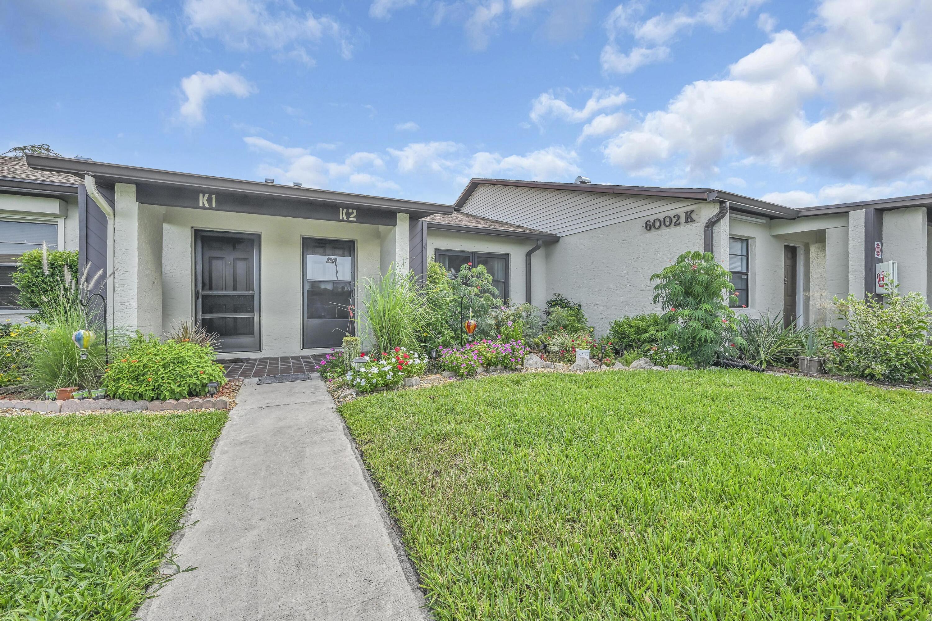 Welcome home to this super cute and beautifully maintained townhome featuring a bright, open-concept layout designed for comfortable living and effortless entertaining. The kitchen has been thoughtfully remodeled to create a spacious, wide-open floor plan that flows seamlessly into the main living areas. Recent updates provide peace of mind, including an updated A/C, roof, windows, and updated bathroom vanities. Outside, you'll love the freshly landscaped yard that adds to the home's inviting curb appeal. Whether you're a first-time homebuyer, looking to downsize, or searching for a low-maintenance Florida retreat, this move-in-ready townhome is the perfect place to call home. Don't miss your opportunity to own this charming, updated property!