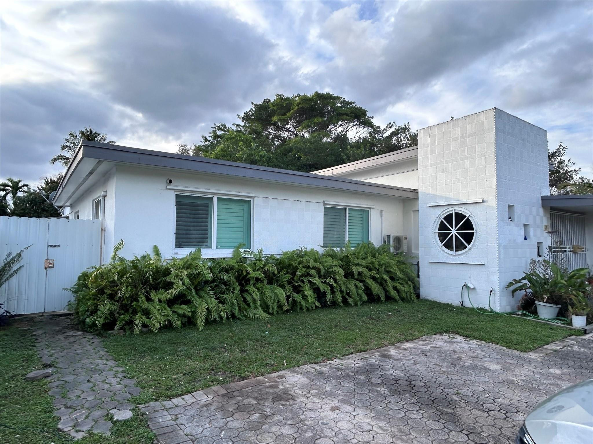 A TRUE and RARE hidden Gem! Homes like this don't come around often. Come see for yourself! 3 separate living spaces, each with its own private entrance, offering flexibility and income potential. Main residence has 2 bedrooms sharing a full bathroom, a spacious primary ensuite w/ kitchen & bathroom (rented). Bright FL room adds more space perfect for entertaining, relaxing, or a home office next to a large Laundry room. Separate studio with a full shower (rented) provides additional immediate income. Plantation Shutters throughout. Natural light with high ceiling in main area. Large backyard Oasis with a generous patio, 3 mature fruit trees, 3 Sheds, ample room for a pool. Amazing opportunity to own a property with space, privacy, and 2nd floor expansion potential. Sundays Showings only.