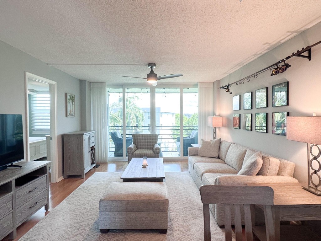 Immaculate, top-floor 2-bedroom at Royal Park. This bright and spacious unit is ready to move in without any work required. High-end laminate flooring throughout. Updated impact windows with Hunter Douglass custom shades. Instant hot water heater and air conditioner installed in 2020. New cabinet fronts in kitchen. Peaceful screened balcony facing northwest with amazing sunsets. Royal Park has 3 heated pools, exercise rooms, saunas and steam rooms, car wash area, BBQ areas, clubhouse, and laundry on ground floor in each building. Gated  entry. 2 pets per unit-no weight restrictions. Must own 2 years before leasing. Ample guest parking. Close to Wilton Manors, downtown, beaches, shopping & transportation. Easterlin Park, Royal Palm Park and Oakland Bark dog park within walking distance.