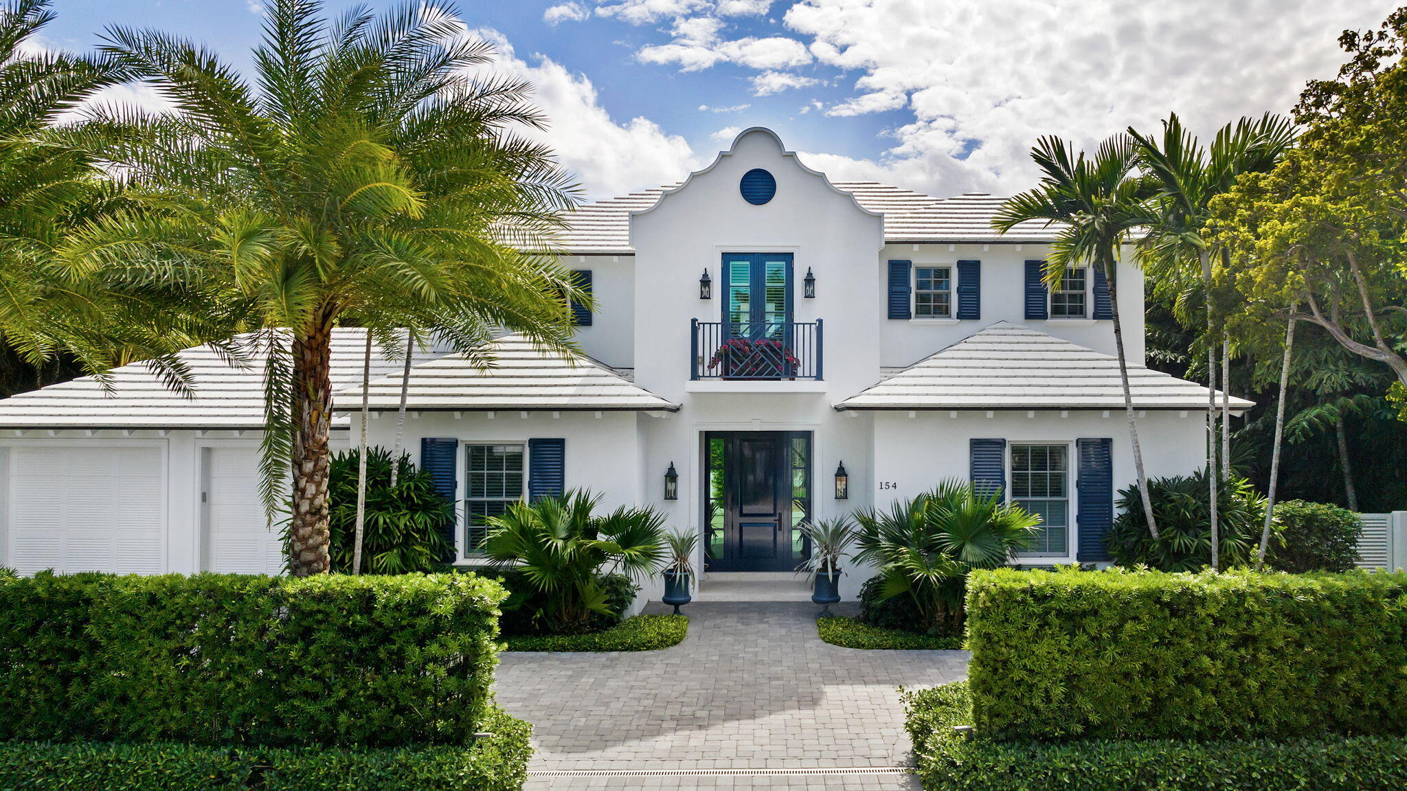 Elevate your lifestyle in this ''nearly new'' four bedroom home with first floor primary suite nestled in the heart of town, ideally situated on a sought-after ocean block. This classic Bermuda style home exudes sophistication with its high end finishes, including wide plank white oak floors, marble mosaics, and custom cabinetry/moldings throughout. The southern exposure bathes the home in natural light, highlighting the exquisite craftsmanship. Other features include fireplace, Savant system, hurricane impact windows, generator, and tankless hot water heaters. Enjoy the tranquility of this prime location offering deeded beach access, Lake Trail access, and close proximity to nearby shops and restaurants. A must see!