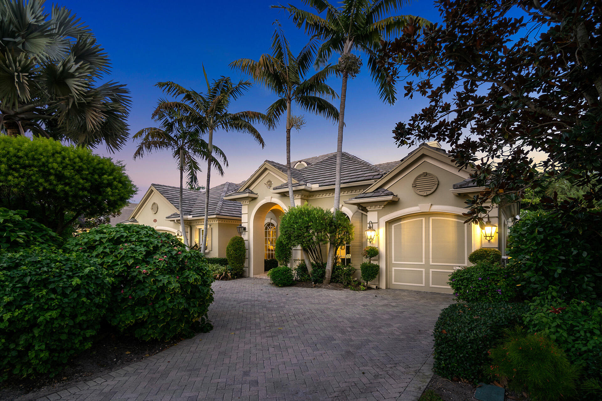2060 Thatch Palm Drive is a custom single-story home built by the renowned SRD Building Corp appointed on an oversized lot in an exceptional location. The furnished home features 3 bedroom suites with optional 4th bedroom/media room, a private office/study, 3 full baths plus powder room, 4,833 living square feet, and a 3-car plus golf cart garage. A welcoming and regal-covered entry is dotted with coach lights leading to a solid wood and glass front door. Guests are welcomed into a stunning chandelier-lined foyer with decorative marble inlay. The cozy formal living room features a natural gas fireplace, an entertainer's bar, and see-through views of the pool. Wood floors, generous crown moldings, designer window coverings, and impressive custom ceiling details are found throughout the open split floor plan. The elegant formal dining room has Wainscot paneling, can comfortably seat eight, and is in close proximity to the temperature-controlled wine room with cedar racks. The gourmet kitchen has custom wood cabinets, premium integrated appliances, dual center islands with sinks, and opens to the family room and breakfast dining area for more casual and inclusive entertaining. The spacious master suite offers a private retreat with tropical pool views, and a private door opening to one of the covered patios. The home is cocooned in lush tropical landscaping giving the pool and spa a private and colorful backdrop. The covered patio has plenty of space for dining/lounging and features a fully-equipped summer kitchen with built-in BBQ and wrap-around bar. Property being sold AS-IS.