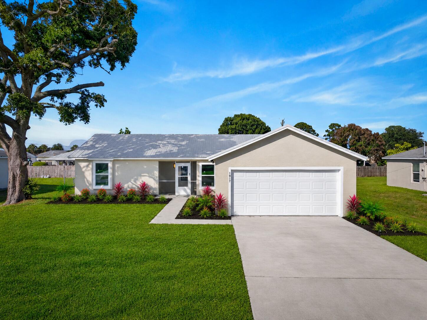 Fully renovated and move-in ready 3-bedroom, 2-bath home located in highly sought-after Port St. Lucie. Features include a brand-new metal roof, impact windows, and a sleek new kitchen with quartz countertops and brand-new LG appliances. Enjoy luxury waterproof vinyl flooring throughout, fresh paint, new doors, baseboards, and updated lighting. Both bathrooms are fully renovated with clean, comfortable finishes. Sharp, stylish, and turnkey—this home delivers comfort, quality, and peace of mind with every upgrade already done. A rare find in a prime Port St. Lucie location—don't miss it.