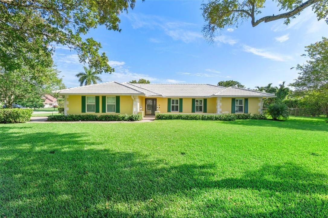 WELCOME HOME to this spacious home in the heart of Coral Springs - 4 bedrooms / 2.5 bathrooms / Pool with Heater and large corner lot - over 1/3 acre.  Beautifully upgraded kitchen with two islands, double wall ovens, pantry, lots of lighting, S/S appliances and granite countertops. The kitchen has an area for a table along with seating at an Island. Living, Family and Dining rooms have ample space for entertaining along with a large paver patio area with Heated Pool. The backyard is fenced-in with a pergola. In-house Laundry Room with utility sink and plenty of storage. Impact windows and NO HOA.