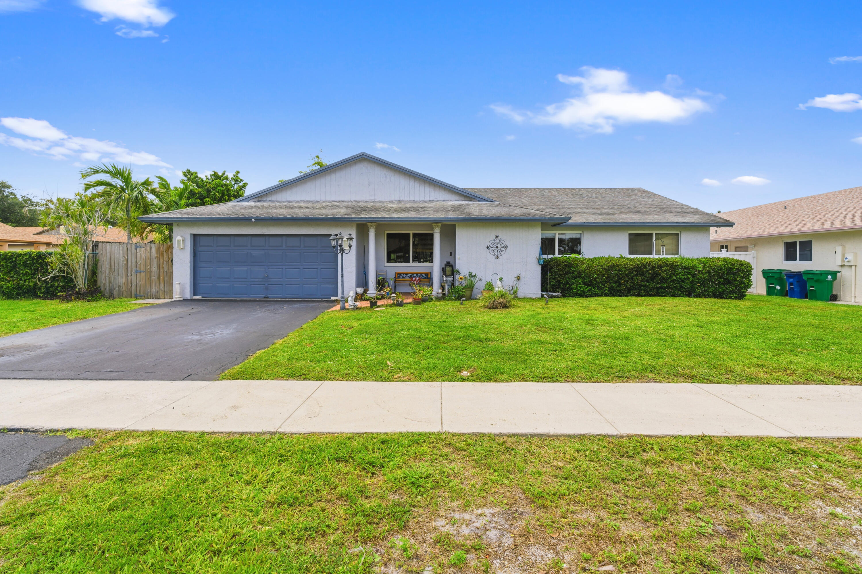 FANTASTIC LAKE VIEWS FROM THIS SPACIOUS THIS 3 BEDROOM 2 1/2 BATH POOL HOME WITH 2 CAR GARAGE* IN DESIRABLE FLAMINGO GARDENS OF COOPER CITY -NO HOA!!! PARTIAL IMPACT WINDOWS*OPEN KITCHEN WITH WOOD CABINETS, GRANITE COUNTER TOPS AND STAINLESS STEEL APPLIANCES*LARGE DINING & LIVING ROOM AREA WITH REAL WOOD BURNING FIREPLACE*TILE FLOORS THRU OUT*VOLUME CEILINGS*FRENCH DOORS*BAR AREA*NICE COVERED PATIO AREA OVERLOOKING THE POOL AND LAKE-GREAT FOR RELAXING OR ENTERTAINING FAMILY & FRIENDS*GARAGE WAS PARTIALLY CONVERTED BUT CAN EASILY BE CONVERTED BACK*GREAT LOCATION CLOSE TO SCHOOLS, SHOPPING, PARKS  & RESTUARANTS*