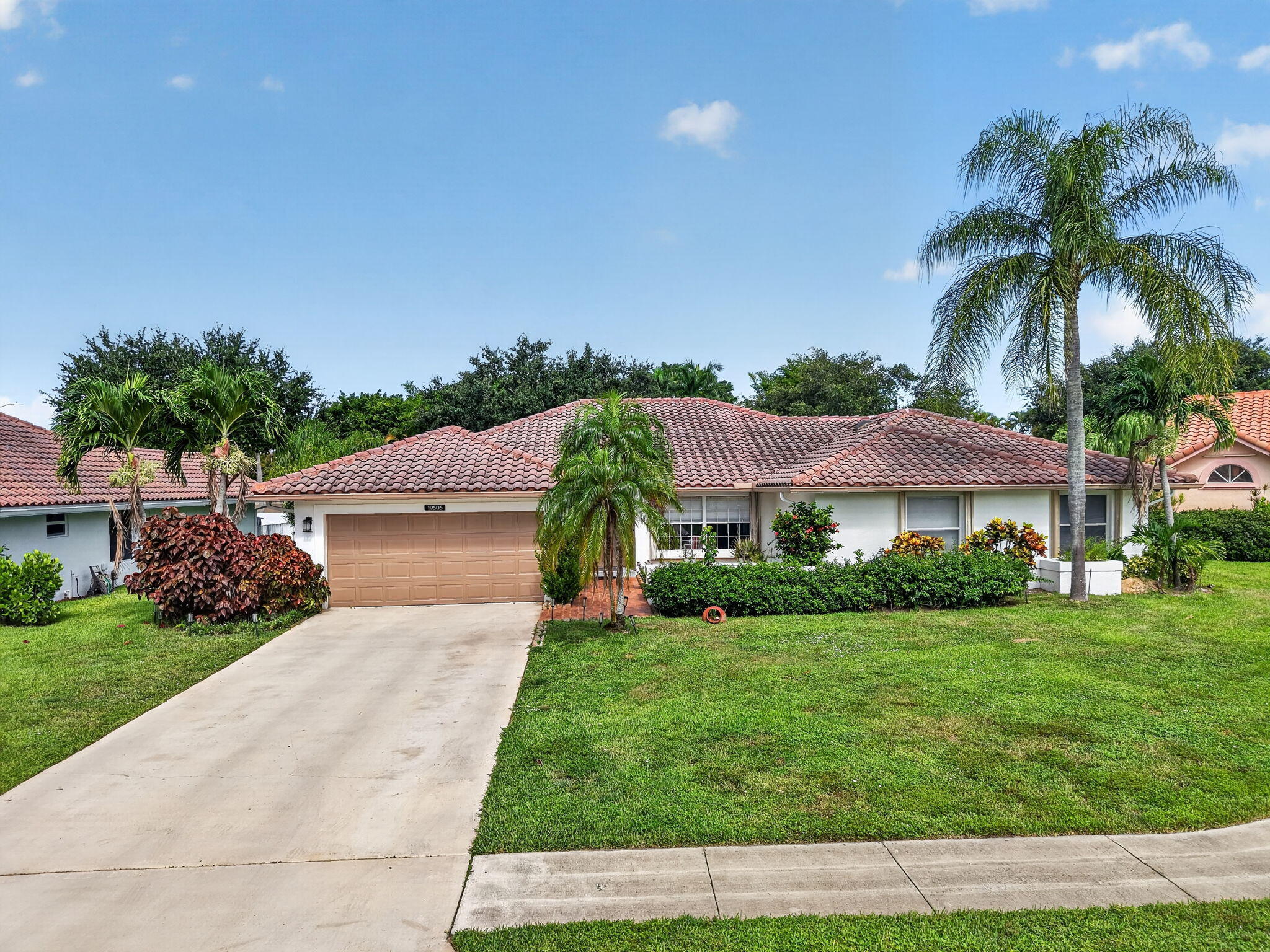 Welcome to this exceptional single-story residence  in Boca Raton, Florida. This thoughtfully designed covered pool home offers 2,649 square feet of finished living space with four spacious bedrooms, a TV room and three full bathrooms, plus laundry room. A large living area plus secluded dining area, is perfect for entertainment. The attached two-car garage offers secure parking and storage. This well-appointed residence in Boca Greens 6 at the end of a cul-de-sac presents an excellent opportunity for those seeking quality construction and functional design in a highly desirable quiet and tranquil Boca Raton community.