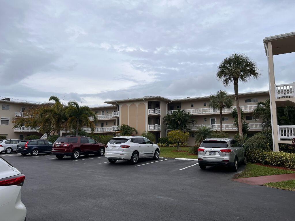 Absolutely stunning ground floor apartment that is ready for you to move right in and start enjoying this beautiful community.  Completely remodeled kitchen with quartz countertops, stainless steel appliances.  Kitchen has been completely opened up to give you a view of your living and dining area.  This beautiful home also features new vinyl plank floors and updated bathrooms.   The A/C was replaced this year and comes with a 10 year warranty.  Accordian shutters on both sliding glass doors.   Close to the mailboxes and laundry room for your convenience.  This community offer several amenities to make you feel like you live at a resort!