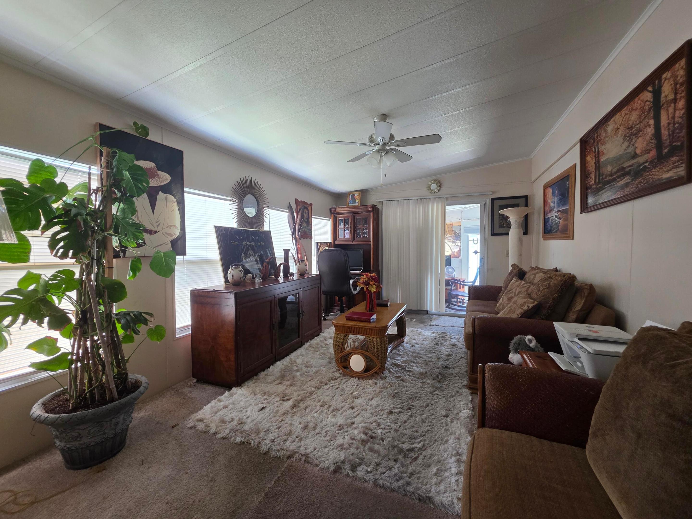 Welcome to 3 Kabassa Ln—your perfect Florida getaway in Spanish Lakes! This charming 2-bedroom, 2-bath manufactured home is being sold fully furnished, making it completely move-in ready—just bring your suitcase and start enjoying paradise. The bright, open layout offers comfortable living spaces ideal for relaxing or entertaining. Located in a vibrant 55+ land lease community, Spanish Lakes offers resort-style amenities including a clubhouse, two pools, fitness center, game room, and FREE golf. Whether you're looking for a seasonal escape or full-time living, this home delivers the easy, active Florida lifestyle you've been searching for.