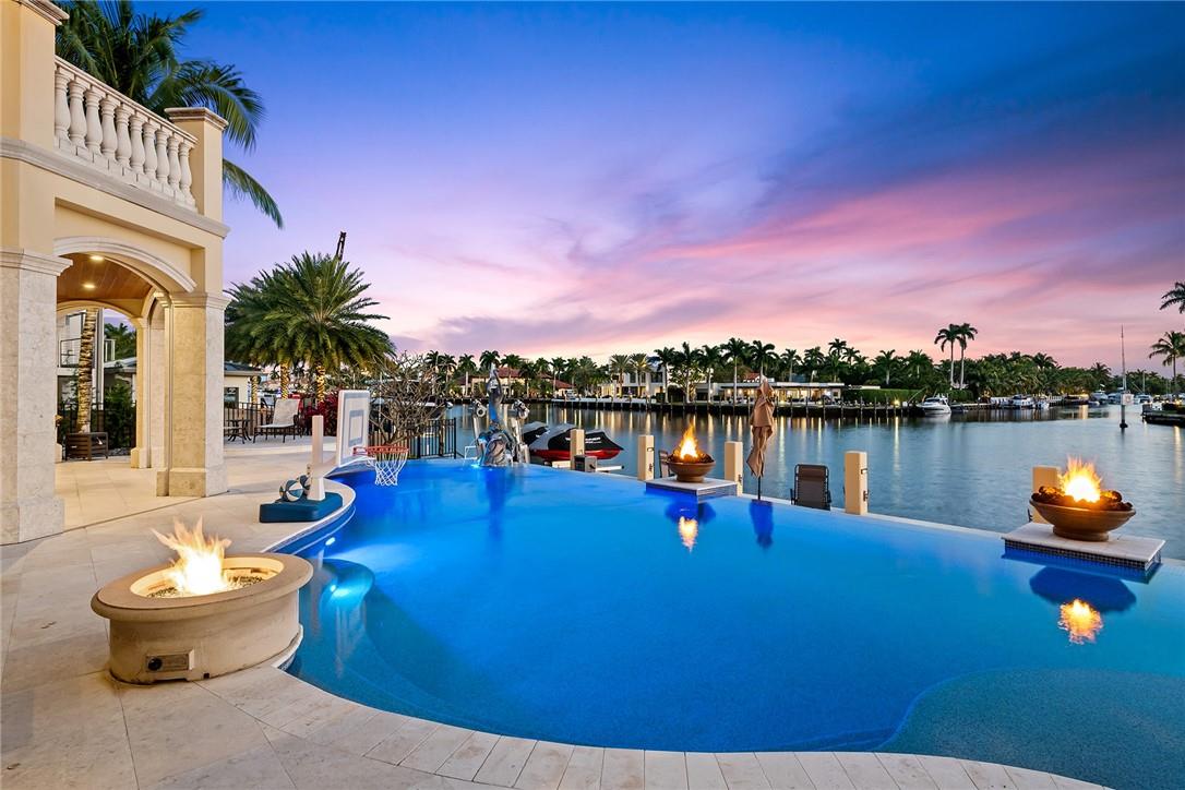 PANORAMIC WIDE WATER VIEWS, 300 FOOT WIDE RIO BARCELONA RIVER! RARE SOUTHERN EXPOSURE LOT PICKS UP PREVAILING BREEZES! SECURE GATED COMMUNITY OF SUNRISE KEY! CUSTOM BUILT IN 2017  BY PREMIERE MASTER GENERAL CONTRACTOR RODNEY SARKELLA! ALMOST 4700 SF UNDER AIR, 7111 SF GROSS, 7" POURED IN PLACE CONCRETE SECOND FLOOR! SUPER PREMIUM FINISHES! DRAMATIC 30' CEILINGS IN MAIN LIVING AREA PERFECT FOR GRAND SOUTH FLORIDA ENTERTAINING AND DOCKAGE FOR YOUR YACHT! ALSO ONE OF THE ONLY PLACES YOU CAN WATERSKI IN YOUR BACKYARD! WHOLE HOUSE CUMMINGS 35K BACK UP GENERATOR THAT RAN FOR 2 WEEKS STRAIGHT A FEW YEARS BACK! TROPICAL BACKYARD WITH MASSIVE POOL AND TWO HOT TUBS!  ENTERTAIN IN GRAND SOUTH FLORIDA STYLE!