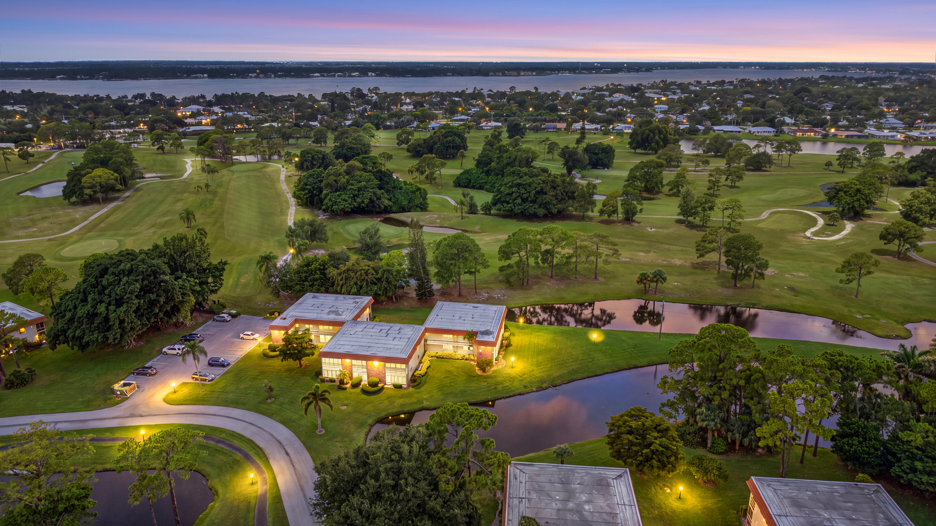 Bask in breathtaking WATER VIEWS from every angle of this gorgeous condo with golf course views too! Tucked away in a private, quiet section of the community, this home brings the beauty of the outdoors right inside. Step into a space designed for easy living. Flooring, Accordian Shutters, A/C and Water Heater have been updated. The main bedroom suite and the bright living room both open onto a private lanai, offering the ideal backdrop for morning coffee & bird watching or evening relaxation. Located in the highly desirable Stuart/Jensen Beach area, Vista Del Lago is an active 55+ community adjacent to The Shores of North River Golf Club. Residents enjoy lushly landscaped walking paths, a community pool, a clubhouse, and a vibrant social calendar. Just minutes from shopping & dining!