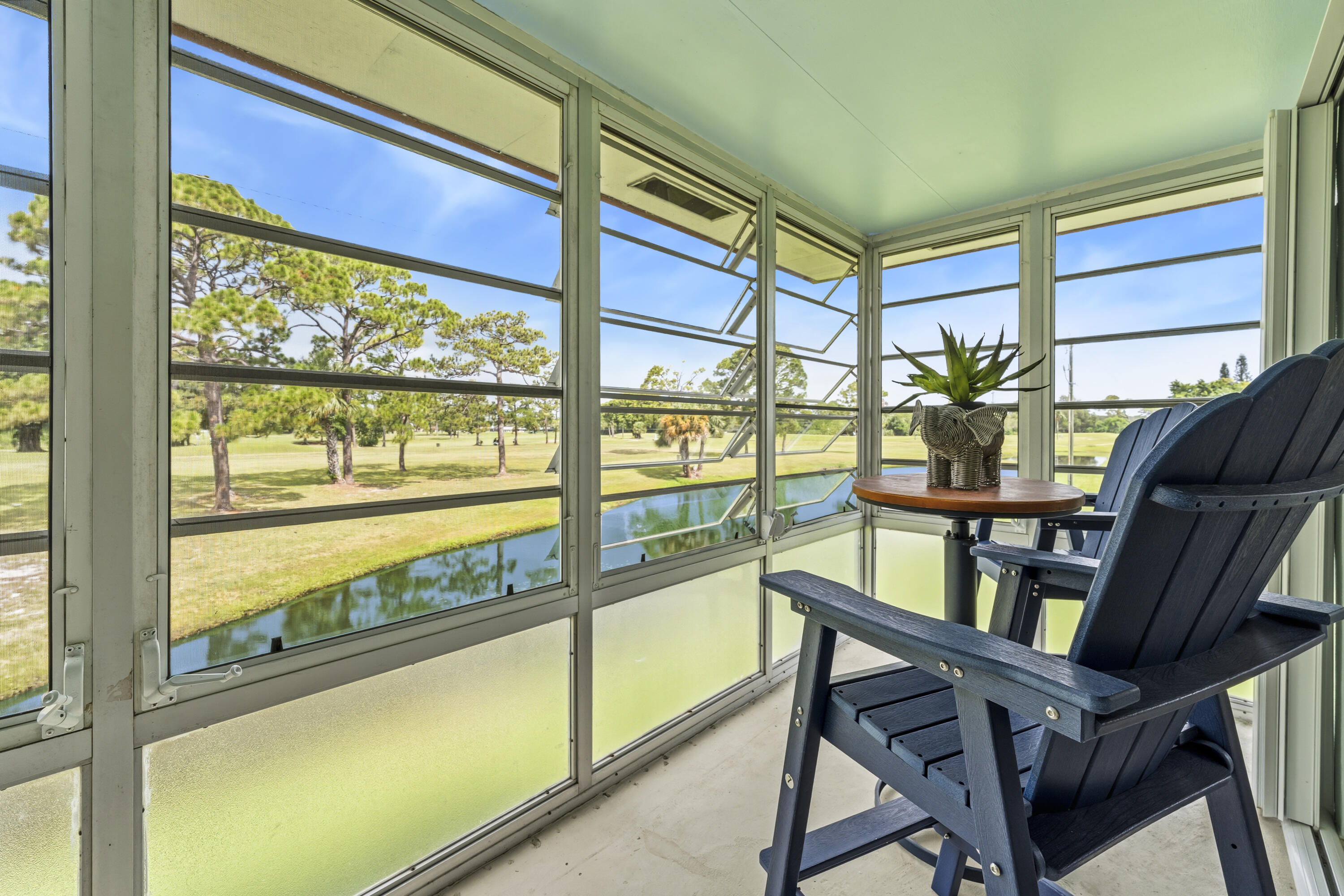 Bask in breathtaking WATER VIEWS from every angle of this gorgeous condo with golf course views too! Tucked away in a private, quiet section of the community, this home brings the beauty of the outdoors right inside. Step into a space designed for easy living. Flooring, Accordian Shutters, A/C and Water Heater have been updated. The main bedroom suite and the bright living room both open onto a private lanai, offering the ideal backdrop for morning coffee & bird watching or evening relaxation. Located in the highly desirable Stuart/Jensen Beach area, Vista Del Lago is an active 55+ community adjacent to The Shores of North River Golf Club. Residents enjoy lushly landscaped walking paths, a community pool, a clubhouse, and a vibrant social calendar. Just minutes from shopping & dining!