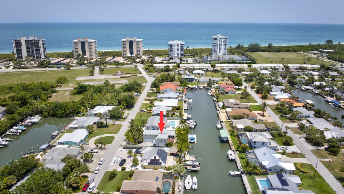 SELLER FINANCING AVAILABLE! Live the dream on Hutchinson Island! This 3BR + den, 3.5BA waterfront home offers deep water access with 2 boat lifts and no fixed bridge just minutes to the Intracoastal and Atlantic Ocean. Features include a new 2024 roof, modern bathrooms, a spacious kitchen with island seating, a large covered patio, and a private dock, creating the perfect setting for relaxing or entertaining. No HOA means you can bring your boat, RV, and live without restrictions. Whether walking to the beach or launching your boat from home, this property offers it all, coastal charm, functionality, and freedom.