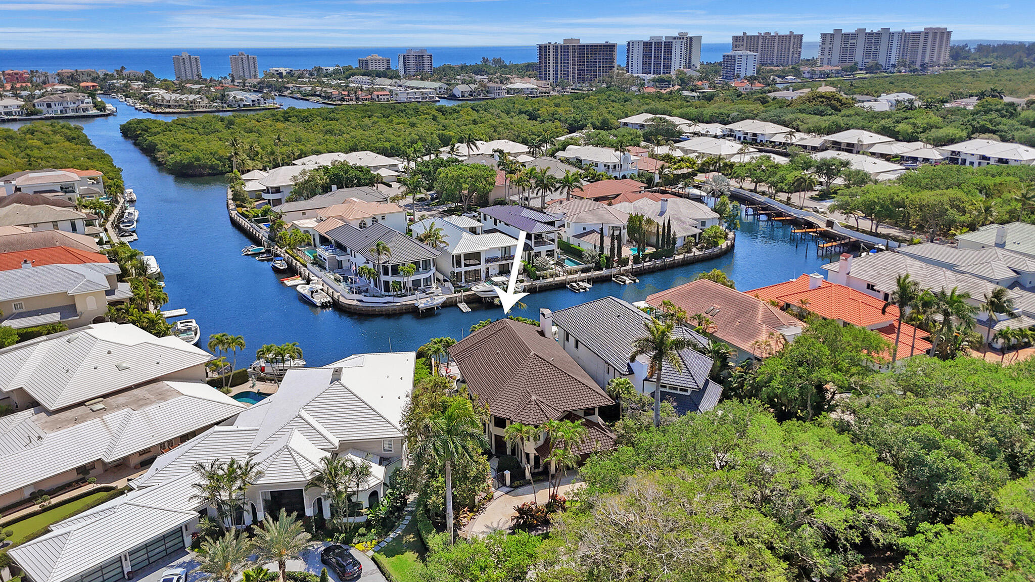 Located in the prestigious Boca Marina Yacht Club community, this exquisite 5,200 SF, east-exposure waterfront estate offers panoramic long water views and direct ocean access for boating. The community's homes each enjoy a private dock, though few offer the straight East view from interior rooms, the patio and the pool deck that 5312 provides.
Designed for seamless indoor-outdoor living, the home features sliding glass doors from the Breakfast Room, Dining Room and Living Room that open to the wrap-around patio which is perfect for day-time Florida sunshine, or enjoying evening alfresco dining. The open-concept kitchen is ideal for engaging with family and guests while cooking Four Ensuite bedrooms are found on the second floor, easily accessible with the elevator. The Primary Bedroom enjoys a private balcony with a spectacular water view and an updated Bath with soaking tub, glass shower, custom double vanity. 
Pre-school through graduate level education opportunities are available in Boca Raton. Nearby polo grounds, Mizner Park for shopping, entertainment and dining, country club options for golf and socializing. Travel from PBI, FLL and MIA convenient with BrightLine and TriRail transit.
The home has hurricane windows and doors, 2017 Roof, Elevator, Mahogany front entrance and door.
The Boca Marina community has full-time manned gate, club house; tennis and pickleball courts; playground; dog park.