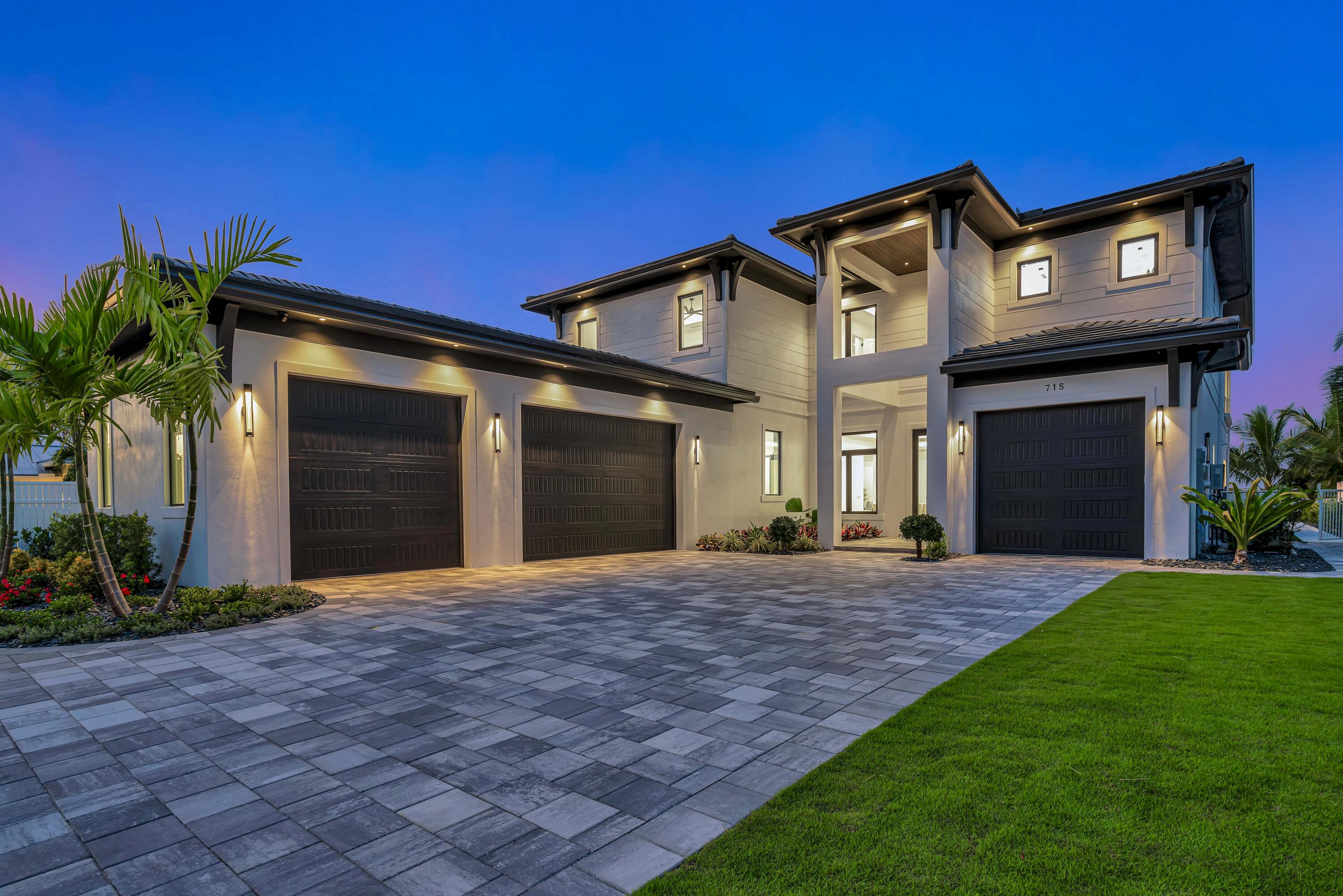 Modern Waterfront Estate in North Palm Beach. Discover a masterpiece of modern living in this stunning custom Vista Builders newconstruction home in North Palm Beach. Nestled in a prime waterfront location, this exquisite 5-bedroom, 5.5-bathroom residence offers the ultimate in luxuryand comfort. Indulge in the luxury of over 5,500 square feet of living space, including a gorgeous master suite. The gourmet kitchen, equipped withThermador appliances and dual islands, offers a convenient butler's pantry for effortless entertaining. Enjoy the convenience of first and second-floor laundryrooms. The spacious living room features a cozy gas fireplace and breathtaking water views. Unwind in your private backyard oasis, featuring a sparkling pool with a spillover spa, a stunning waterfall, covered lanai, and a gazebo for outdoor entertaining. The 75-foot dock with a 24,000 lb. lift provides easy access to the water for boating or fishing. Enjoy breathtaking sunsets, serene water views, and cozy evenings by the outdoor fire feature. The outdoor kitchen is perfect for grilling and entertaining guests. For a touch of luxury and leisure, enjoy a round of golf on the private putting green.
Additional features include a 4-car garage, .4012 acres of land, 86 feet of water frontage, and beautifully landscaped grounds.
The Village of North Palm Beach is becoming one of the most sought-after communities in Northern Palm Beach County. It is a coastal community with easy access to both the Palm Beach and the Jupiter inlets for some of the best fishing in the world. Combined with easy access to Palm Beach International Airport, some of the best beaches and a wide range of dining establishments in the area, the village is becoming one of the top communities in Northern Palm Beach County. The Village is also home of the newly renovated North Palm Beach Country Club, featuring an Olympic swimming pool, splash pad, picnic area, an on-deck tiki hut, 200 seat banquet room, 100 seat The Grill and The Clubhouse restaurant, A Jack NicklausSignature Golf Course, and a full featured Tennis Facility with Har-Tru courts. It is open to the public and village residents.The village was recently designated as a golf cart friendly community. Sale consisted of the buyer paying seller's closing costs and personal property
