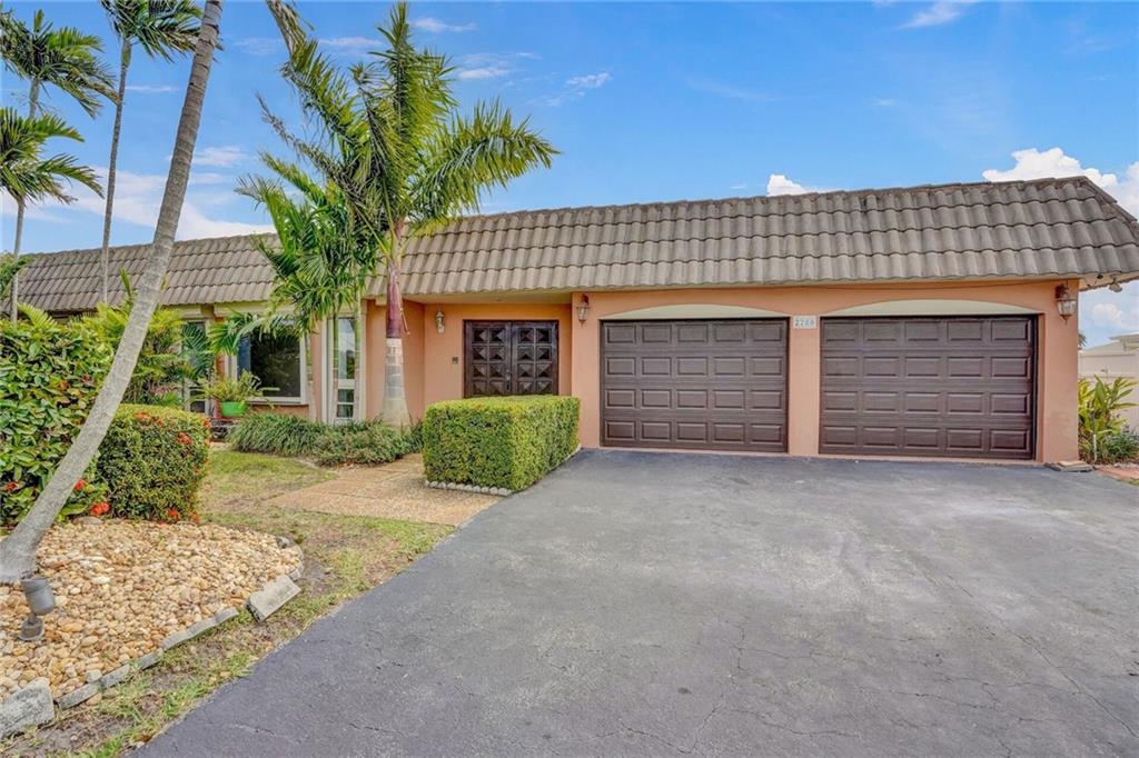 One of the lowest price per sf, deep water homes in Broward County! Priced for a quick sale! Spacious pool home in exclusive Santa Barbara Shores community. With 95' of waterfront, no fixed bridges & only 500 yards to the Intracoastal, this property is a boater’s paradise. The exterior features a large deck with a pool, summer kitchen, spa & large multilevel dock to accommodate up to an 80' yacht. The home also boasts accordion shutters on all windows & doors, new hurricane garage doors, newer dual A/C units, updated electric panels with integrated 45 KW full home natural gas generator, s.s. high efficiency appliances, new pool pump & much more! See attached Property Features List.  Roomy, inviting layout with 4 bedrooms plus bonus room. This home has unlimited potential!