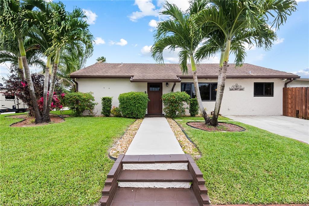 Beautifully maintained 3/2 with 1,350 SQFT under air, plus a 300 SQFT screened in porch. One of the younger homes in the area - built in 1983!! Sitting on a large corner lot, this home features: 2020 IMPACT windows & doors, 2014 HVAC, 2006 dimensional shingle roof, granite kitchen w/ stainless steel appliances, remodeled guest bath, tile flooring, large laundry room & more! Enjoy your fenced back/side yard with 1/2 above, 1/2 below ground pool. Close to several hospitals, restaurants, shops, Hard Rock Casino, FLL airport, downtown & beaches.