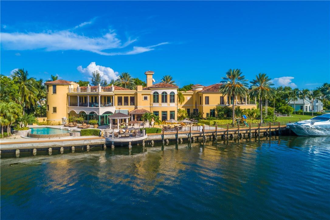 Located within Fort Lauderdale’s guard-gated Harbor Beach enclave, this magnificent, Mediterranean estate is situated on the Intracoastal, capturing sweeping canal and Lake Sylvan views. Offering unparalleled grandeur, the 1-acre+ estate features a 15,000-sq-ft residence, 359 feet of deepwater frontage for several mega yachts and 1,500 sq ft of terrace space. Throughout the residence, find Grecian-style columns, grand fireplaces, intricate wrought-iron detail, exquisite chandeliers and floor-to-ceiling windows. Surrounded by shady palms, features include 10 ensuite bedrooms, a stunning master suite with spa-style bath and walk-in dressing room, a rooftop terrace, infinity-edged pool, outdoor kitchen, theater, gym, massage room, elevator, wine cellar, guest house and 10-car garage.